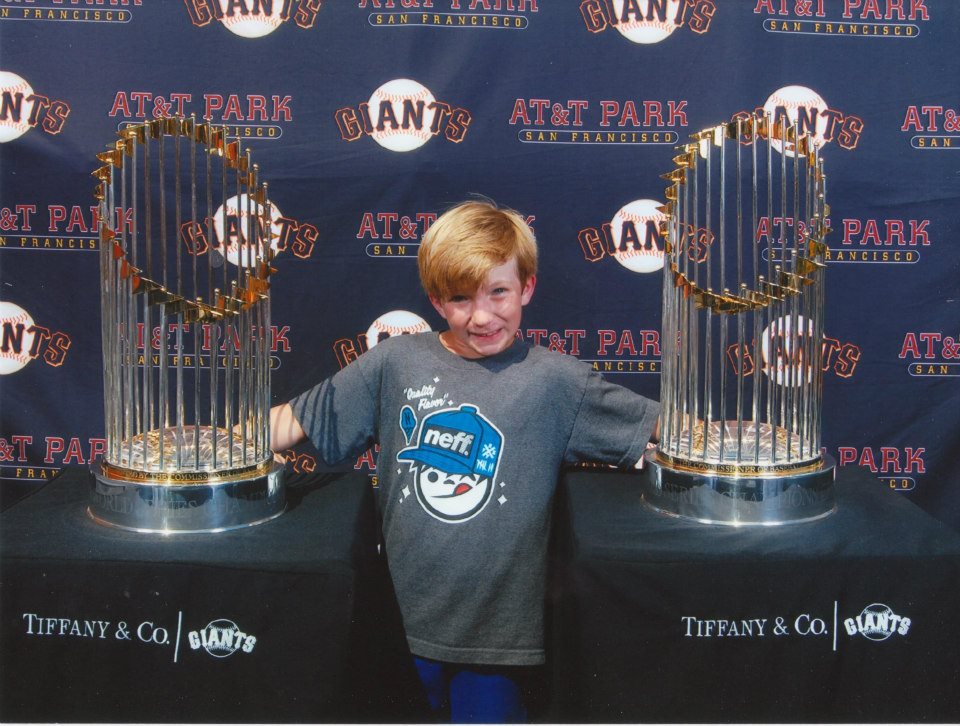 Liam Nelson with the World Series Trophies