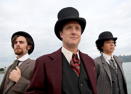 Detective Fix of the Yard (David Abrams), Mr. Phileas Fogg (Cassidy Brown) and his faithful manservant Passepartout (Rami Magron) in Marin Theatre Company's stage production of Jules Verne's literary classic Around the World in 80 Days.