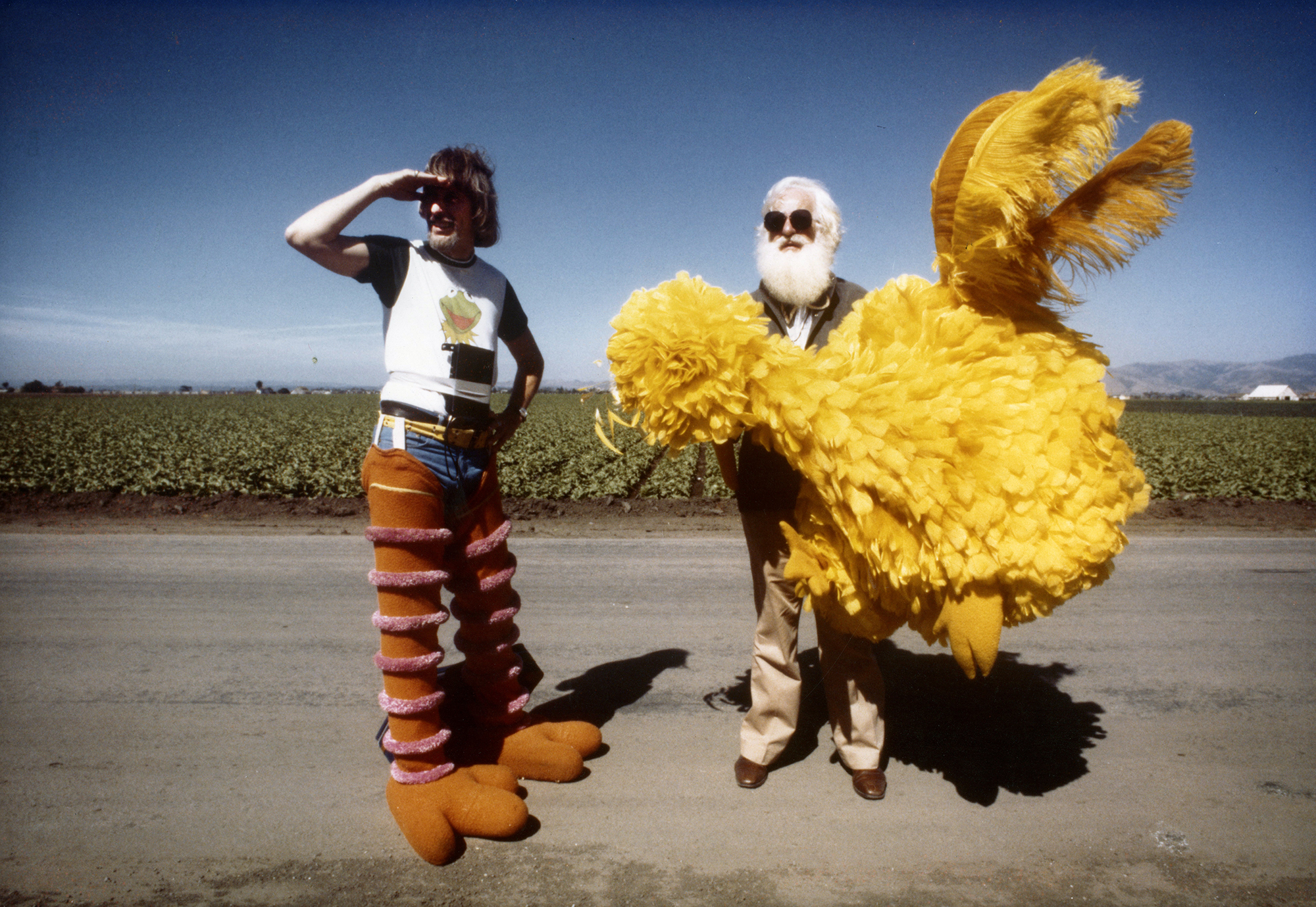   Archival photo of Caroll Spinney and Kermit Love on the set of a Sesame Street production. Photo courtesy of Debra Spinney.  