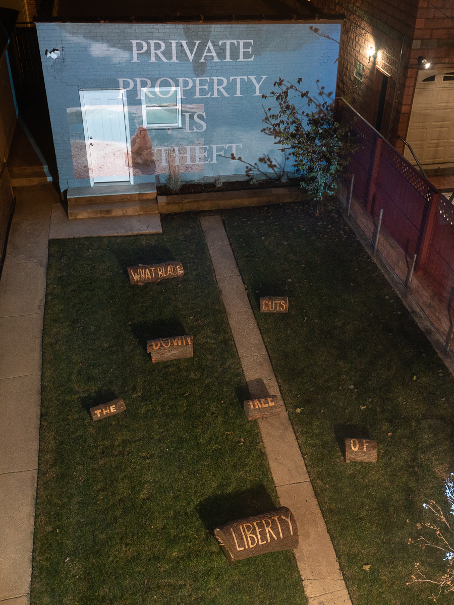 From Top: Mia+Máire, still from It’s Already Too Late , 2018, 12 minute video projection; Jesse Meredith, what blade cuts down the tree of liberty - You Won't Believe It , 2018, Six carved logs, Dimensions variable.