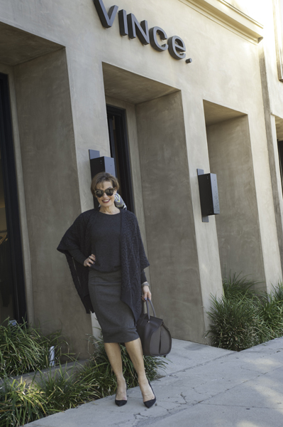 Vince Poncho , Vince Sweater , CAbi Skirt , Manolo Blahnik Pumps , Balenciaga Bag , Pucci Scarf, Karen Walker Sunglasses .