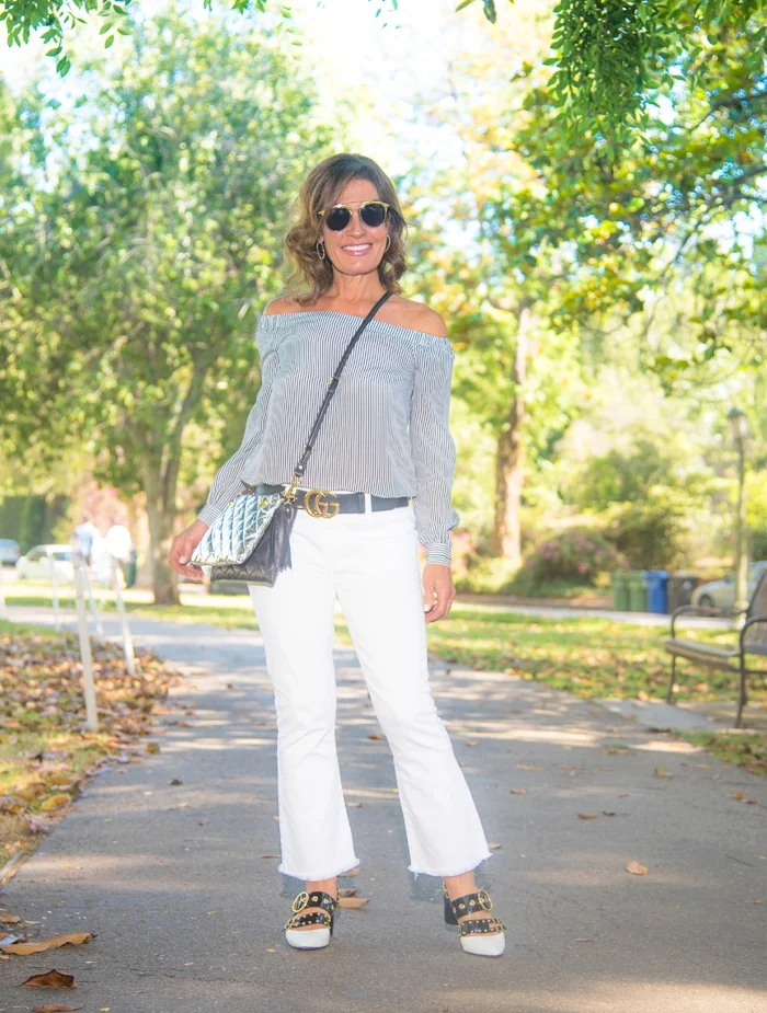 Cabi top , Current Elliot jeans , Bally Shoes , ( also on sale at the Beverly Hills store ), goldno.8 bag , Christian Dior Sunnies, Robin Terman hoops, Gucci Belt.