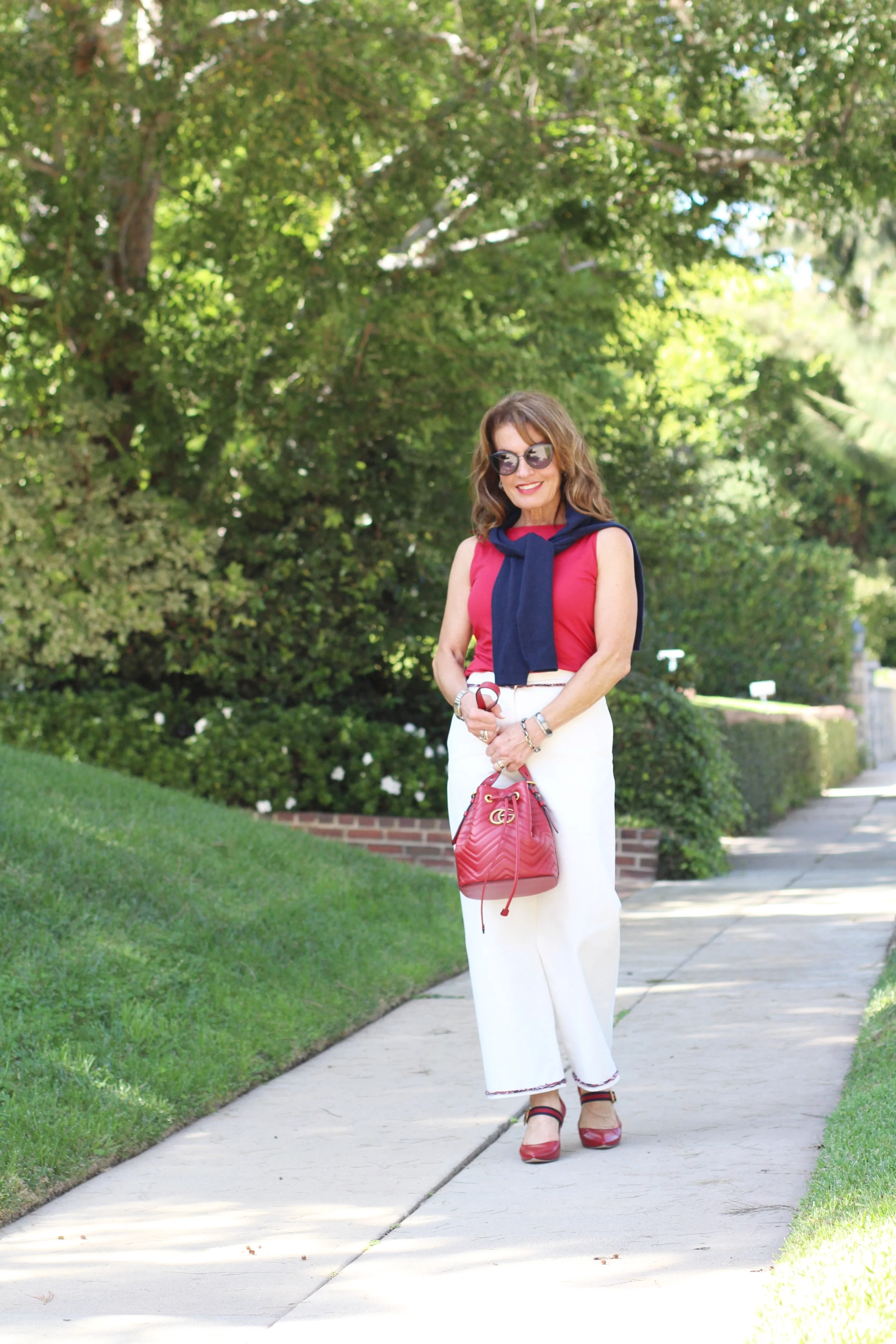 Chanel pants, Worth New York top , C by Bloomingdales cardigan , Gucci shoes and handbag, Suneera bracelets , Chanel shades.
