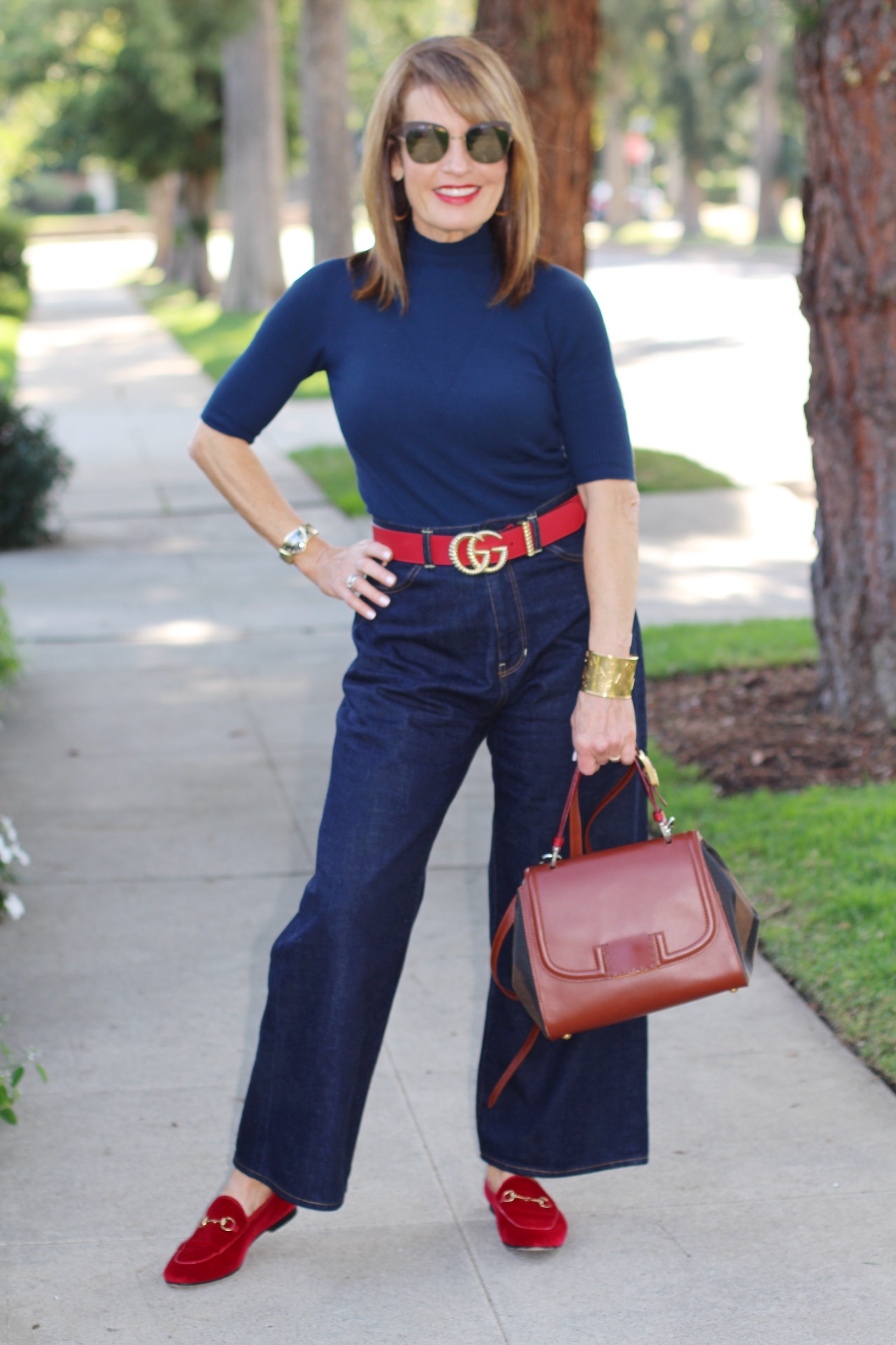 A World Curated sweater, Fig London Jeans similar here, Gucci belt and loafers, Fendi handbag, Hamilton watch, and in silver here, vintage YSL cuff, Mykita shades