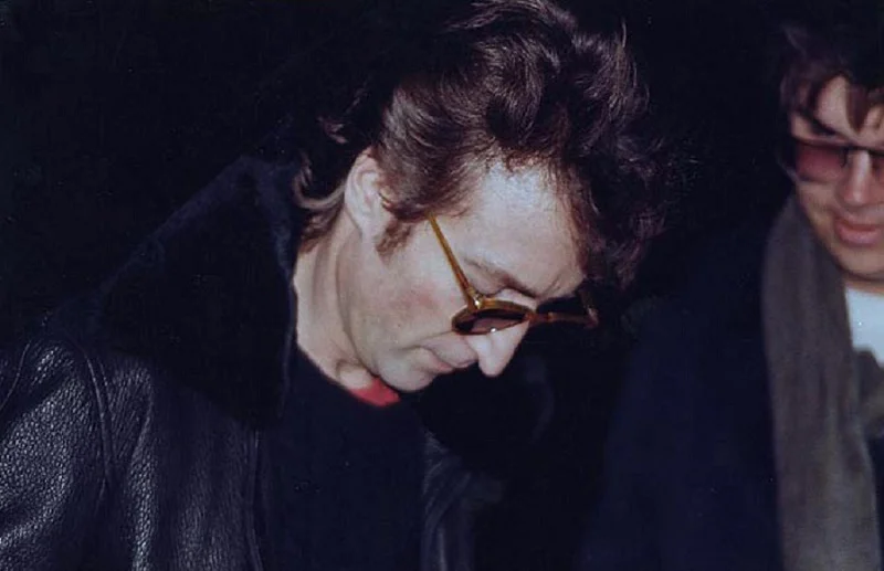 Mark David Chapman asked for John Lennon's autograph outside his Dakota residence. Several hours later, he would meet him there again and kill him.