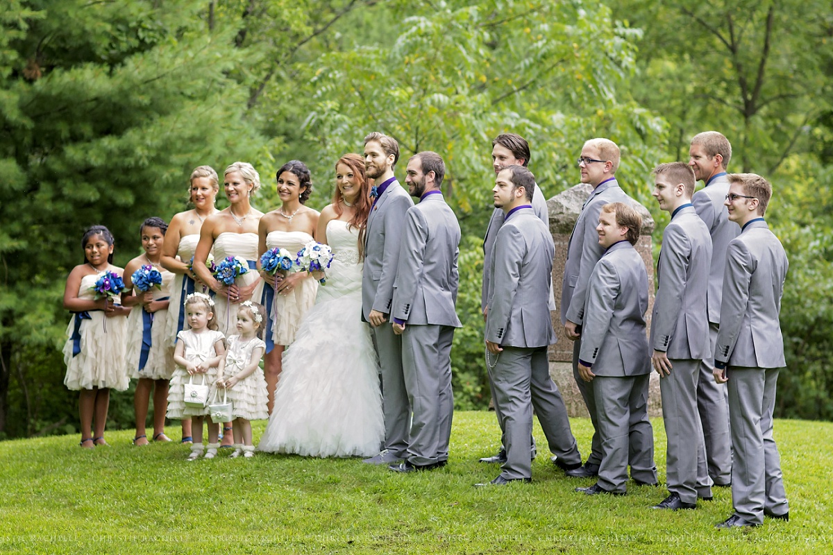 I love this capture from Caroline! You don't see the rain that was falling, the people holding umbrellas over the bride and groom as we set up groupings, or the many sets we photographed. It is just a beautiful group of people and a gorgeous Minnesota location!