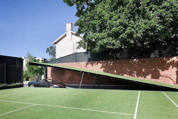Amazing Designs: Astonishing design hidden from view in Toorak. A section of the tennis court raises to reveal a ramp to the underground car park.