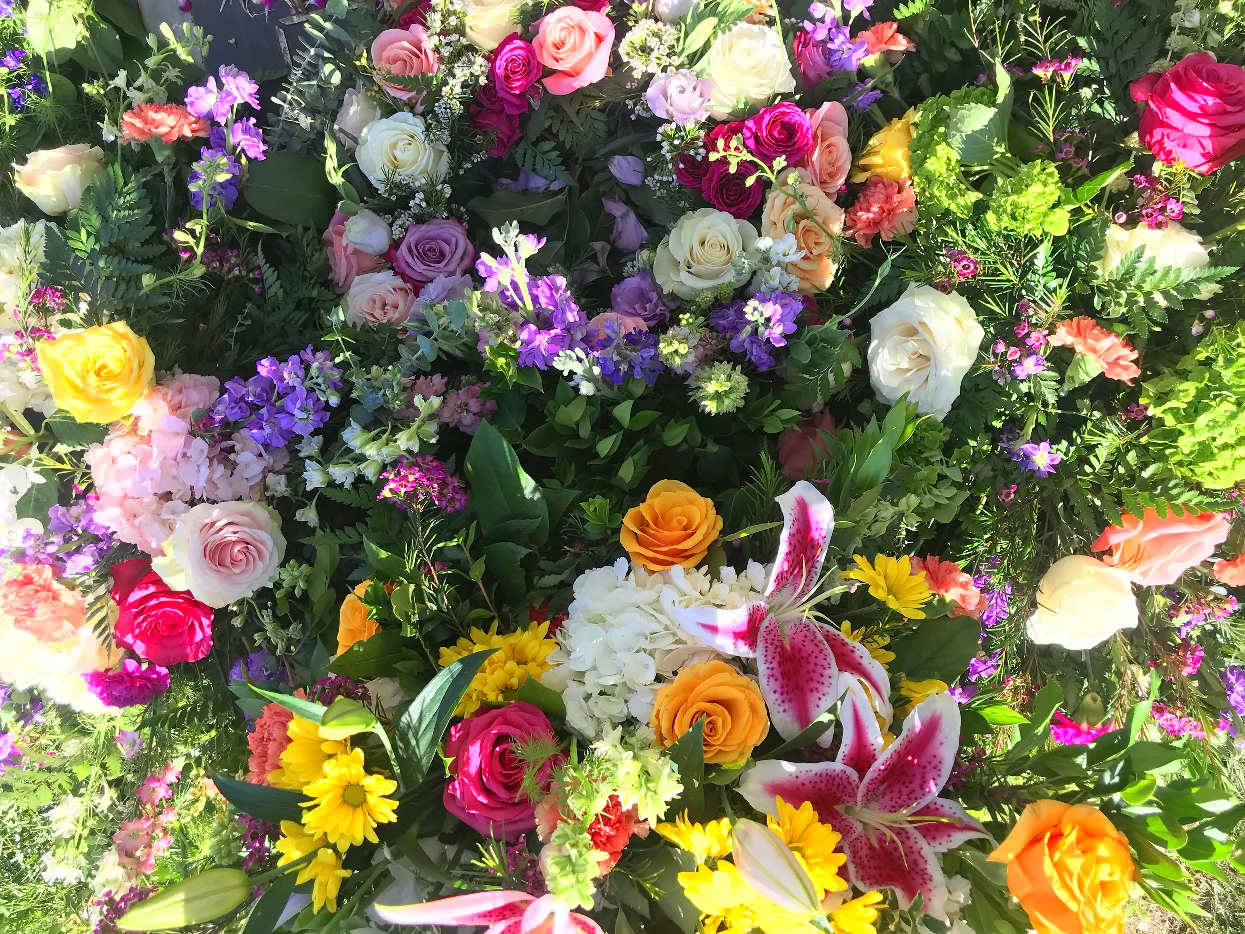 Flowers covering Jan’s grave site after her burial - May 3, 2019