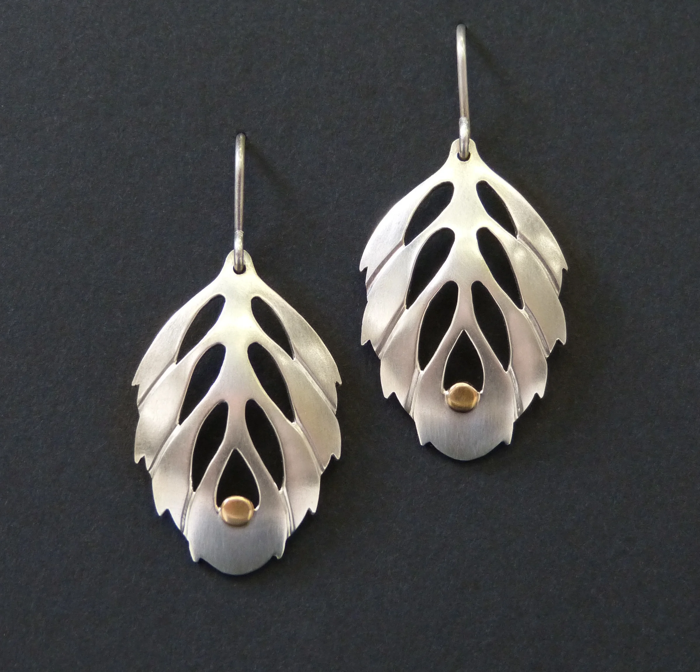  Hand pierced and formed  Sterling silver, 18k gold  35mm long 