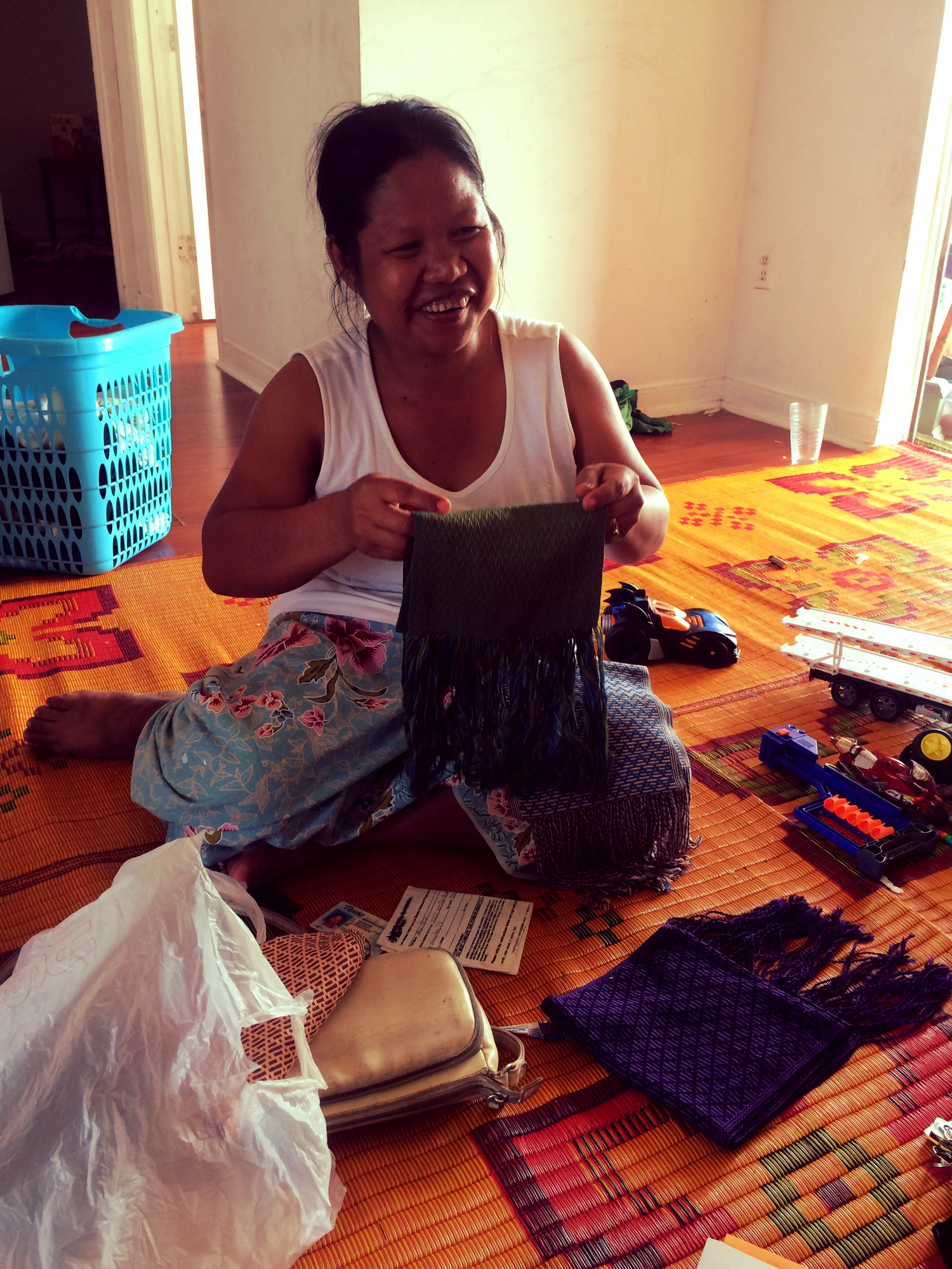 At Mu Mu's home while she showed off one of her hand woven scarves.