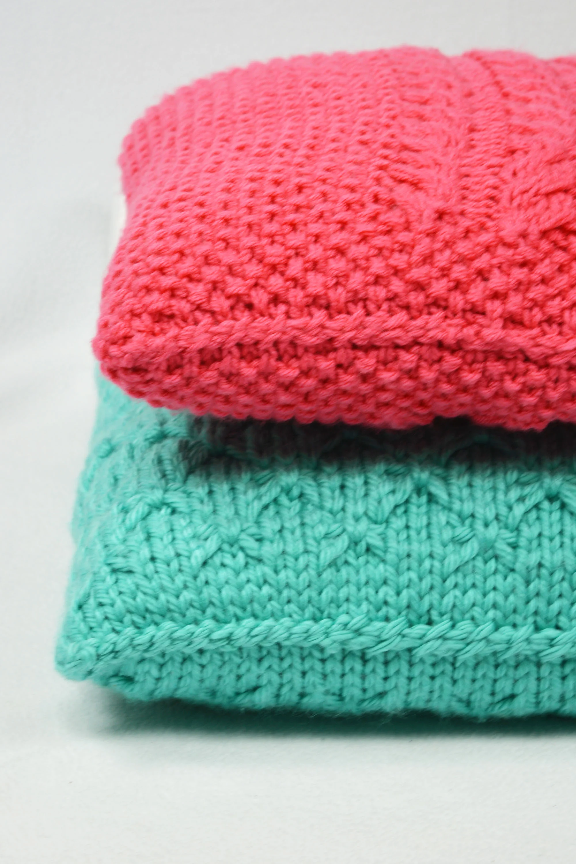 pink and blue knit pillows.jpg