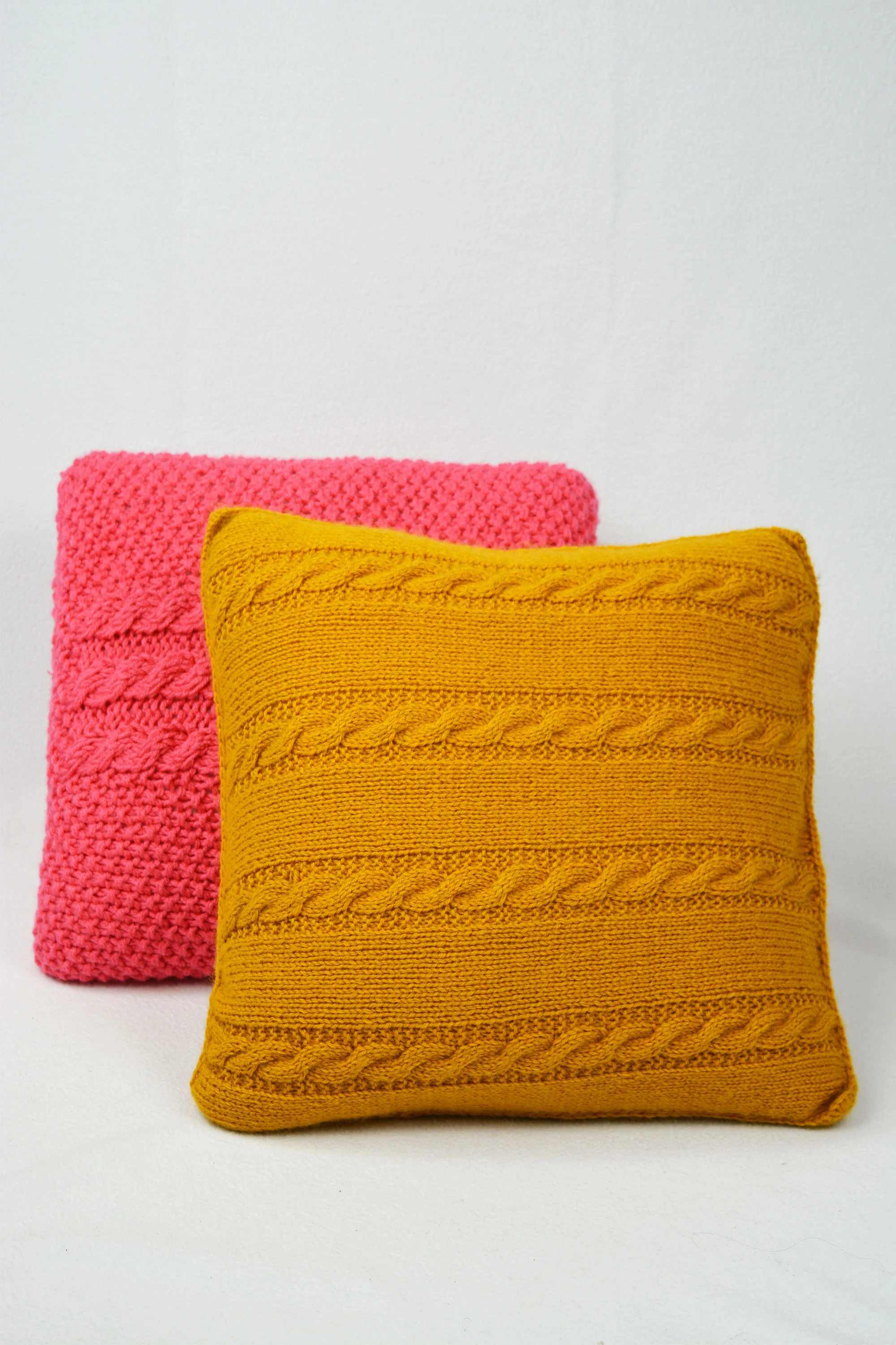 yellow and pink knit pillows.jpg
