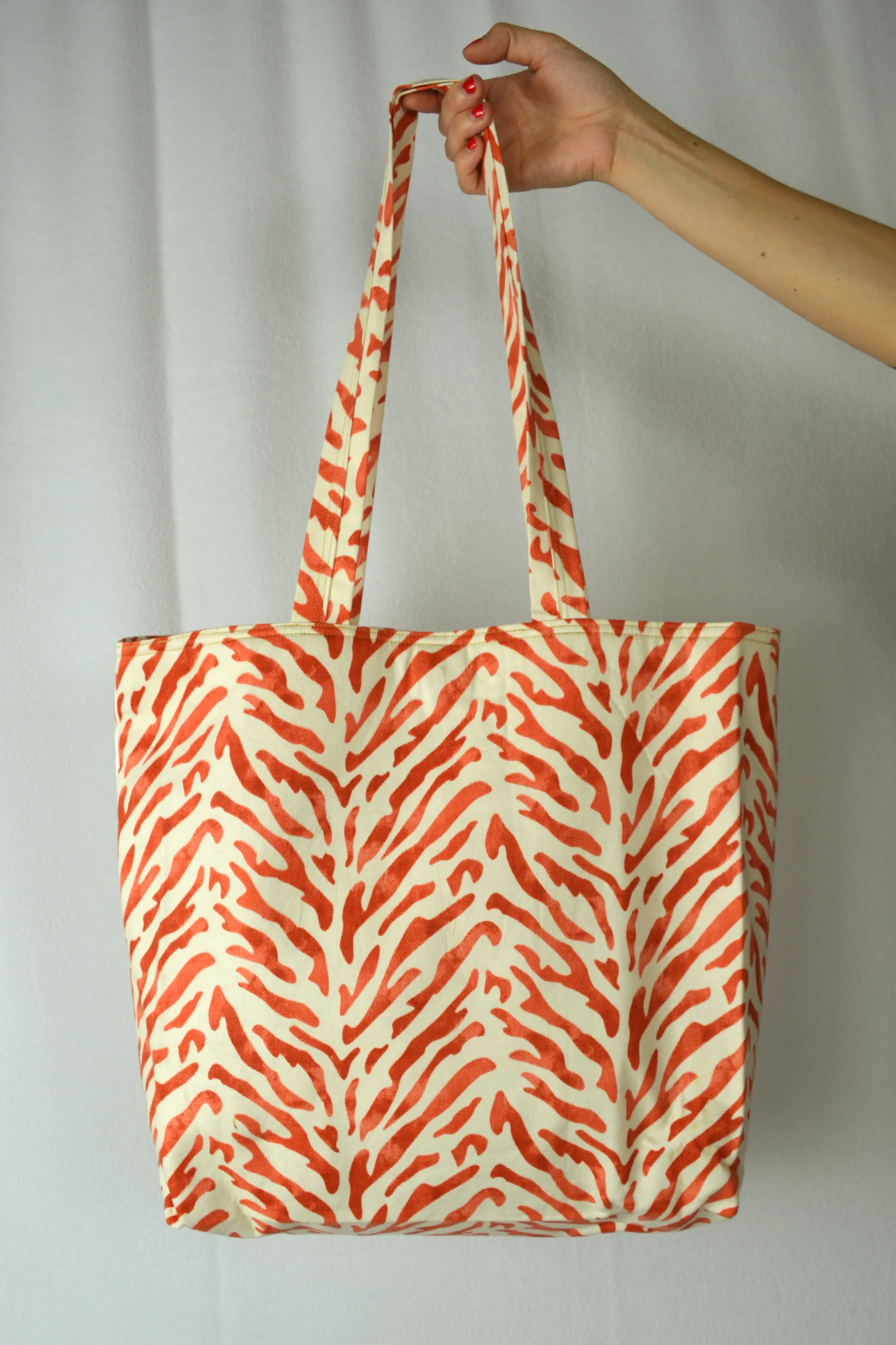 animal print bag orange hanging.jpg