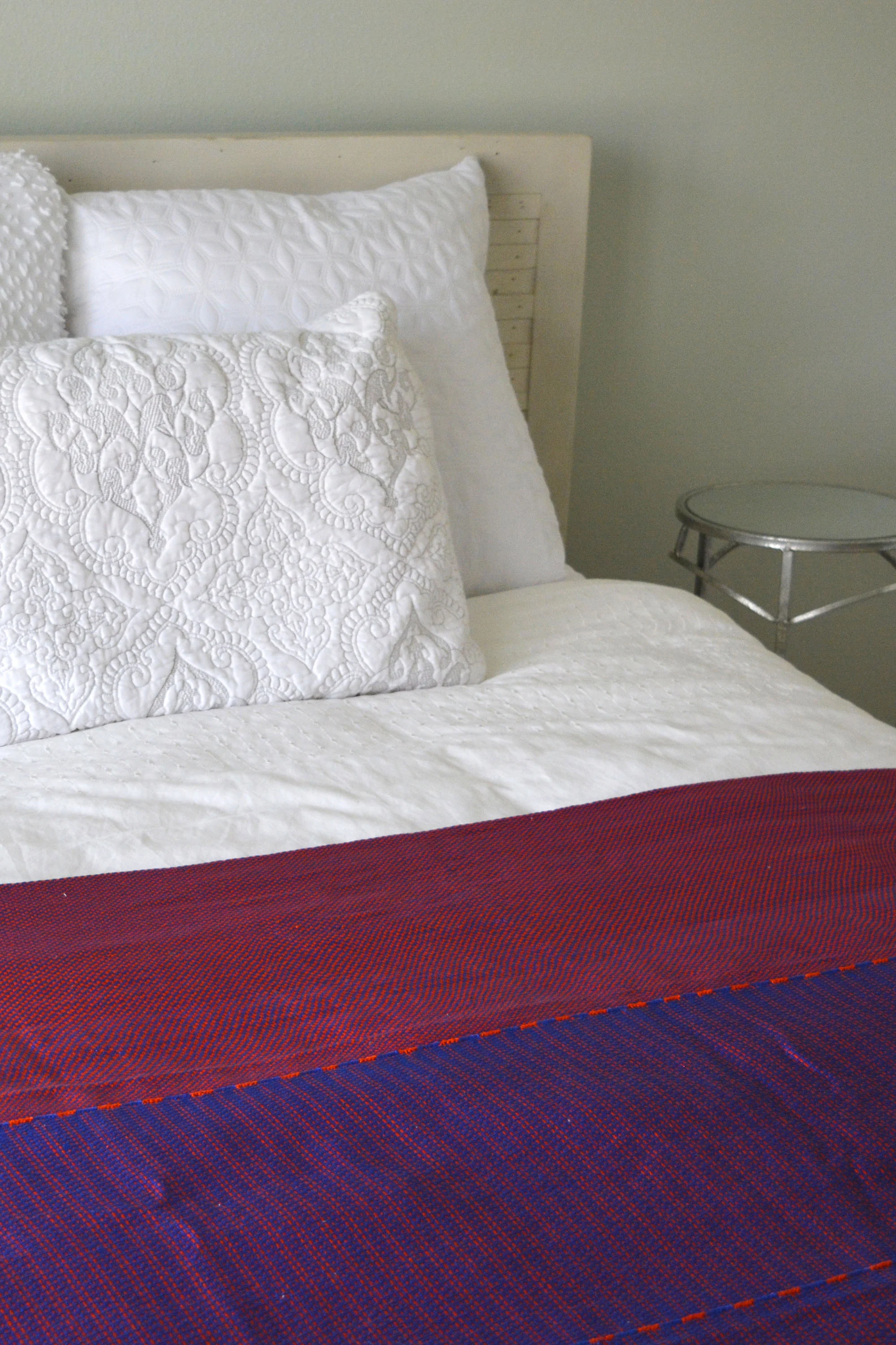 blue and red throw blanket on bed.jpg