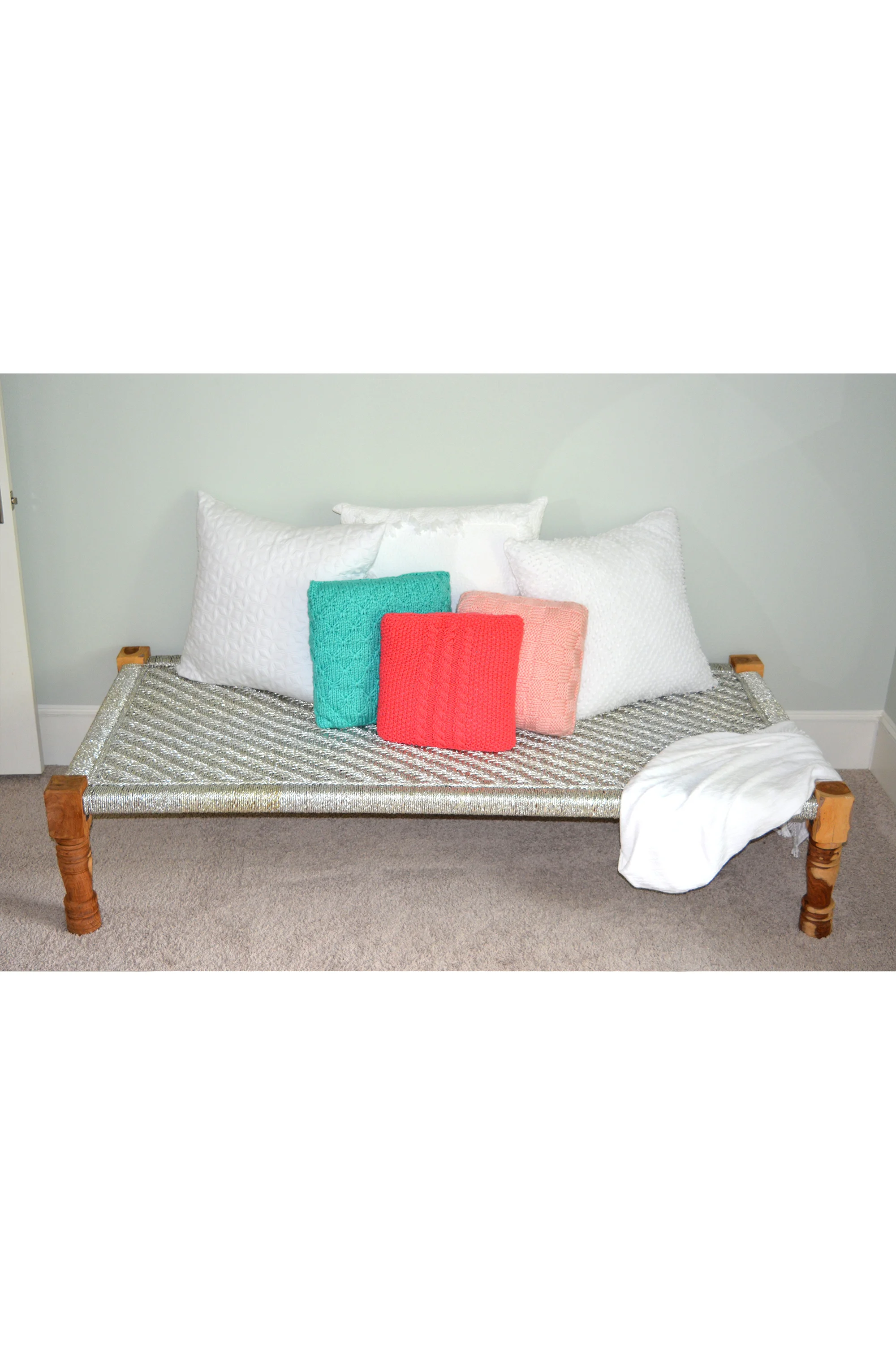 knit blue and pink pillows on bench.jpg
