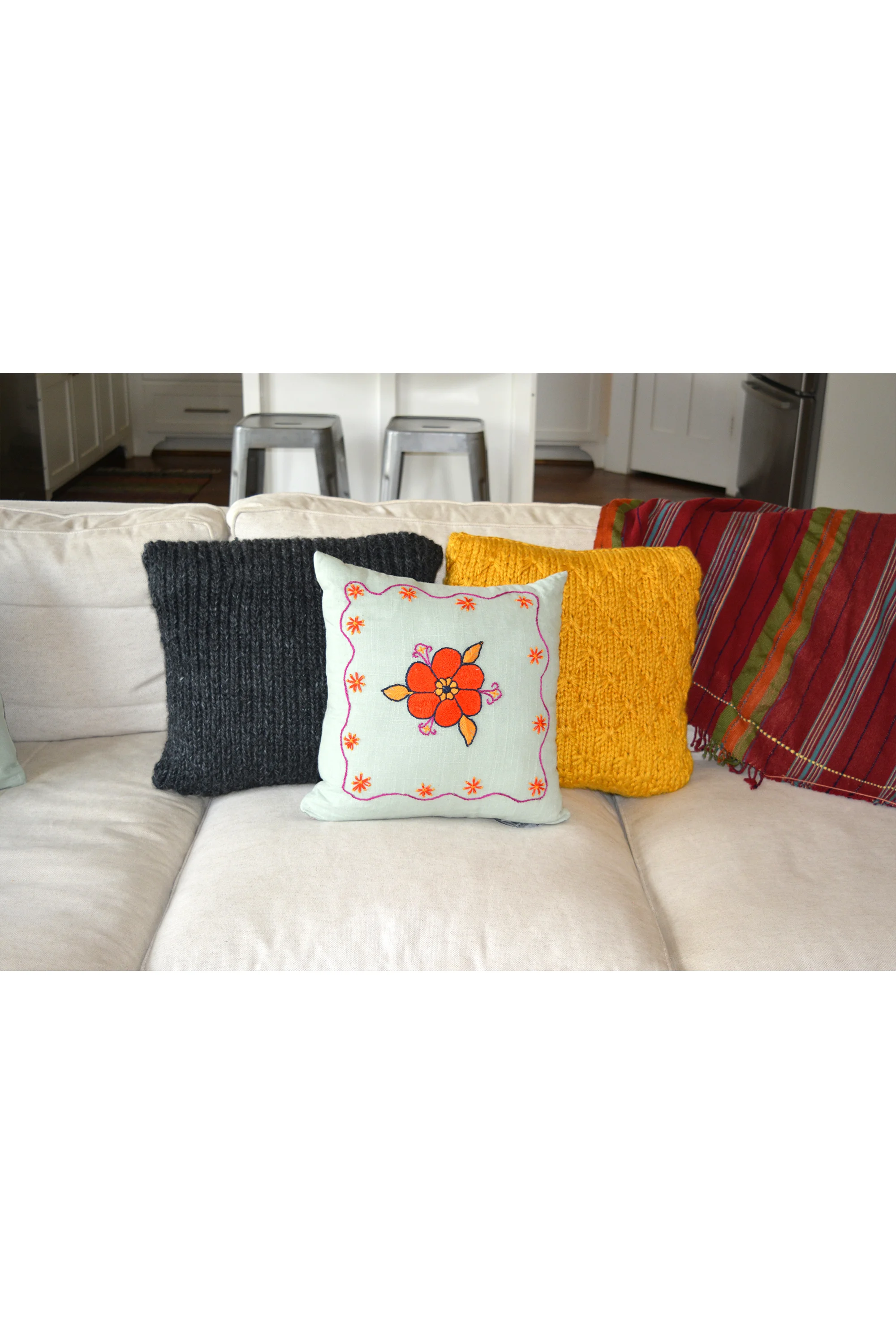 knit and embroidered pillows on couch for web.jpg