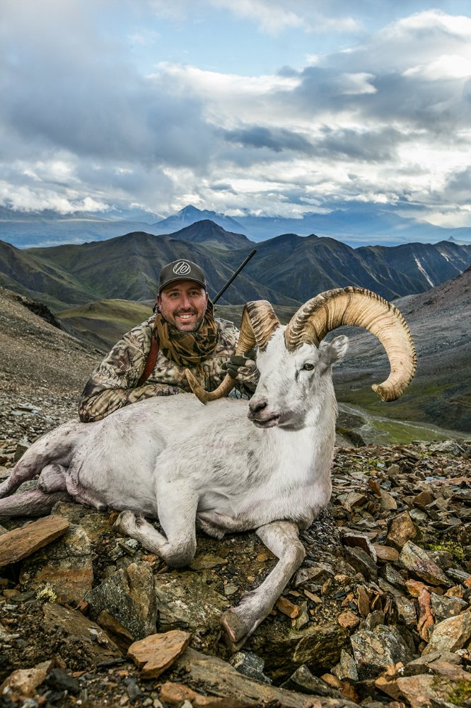 The author with his Dall Sheep Ram, after nine long days in the field. Now the hard work begins to break the animal down and pack him out. Everything except bone and unusable internal organs are taken. The heart was eaten the next morning for breakfast, it makes a very good lean protein to start the day.