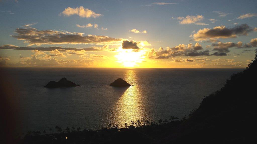 This is the sun-rise vista on top of the Lanikai Hike (an easy to average hike) on the windward side of Oahu near the town of Kailua. The two large rocks you see are called the Mokuluas and are remnants of a 3.8 million year old volcano. If you are an early riser, we can make this wonderful experience a part of your tour. Be sure to wear hiking boots or good cross-trainer style shoes for safety. Or, if you prefer, we can take you on an easy hike to a waterfall and pool in the rainforest as well or an easier hike to Oahu’s East end lighthouse. It is a paved hike all the way and even wheel chair friendly.