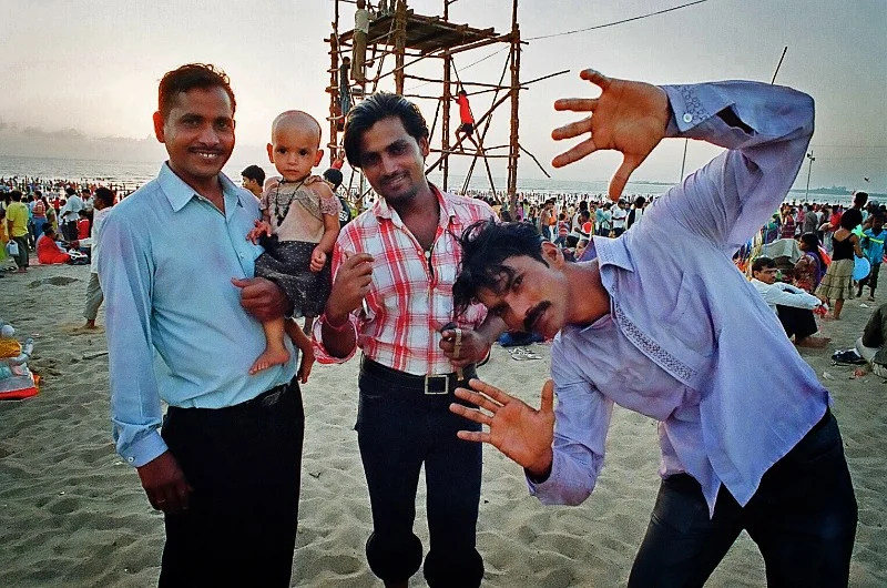 Men and child pose during Ganpati Festival.  Mumbai, India (Copy)