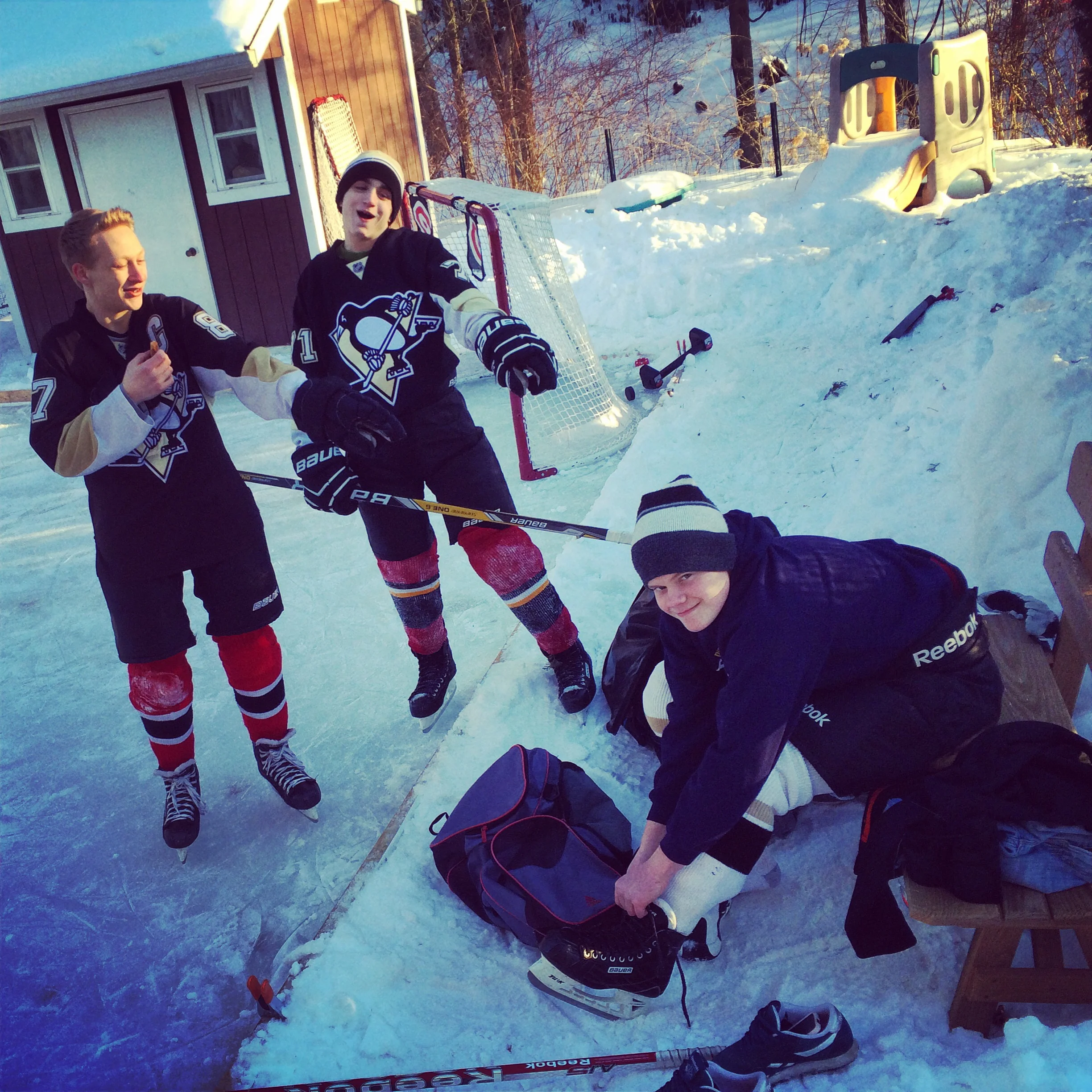 A few of my jr. high hockey players getting ready to play out back. 