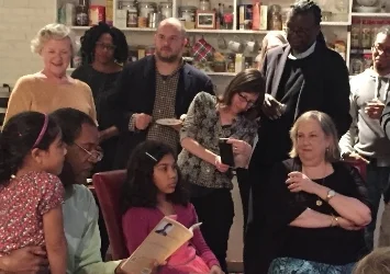 Gregory and his daughters seated with Martha Rhodes. Cornelius Eady, one of the Pulitzer judges, stands behind Martha. Photo by Owen Lewis