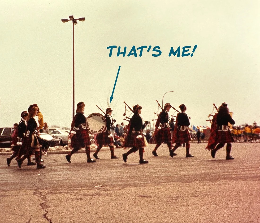 Fort William Ladies Pipe Band, marching in a parade, with text saying "that's me" and an arrow point to Dana. Taken in the 80s.