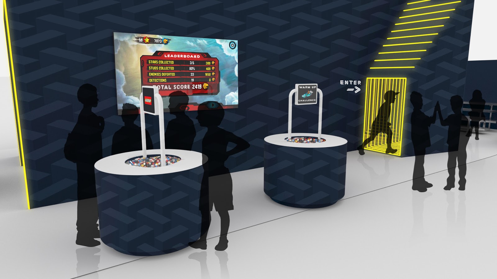 Journey: 02. While the team waits their turn, they follow the mini-build challenges displayed in the practice zone. A large scoreboard of highest time scores is displayed in the same area.