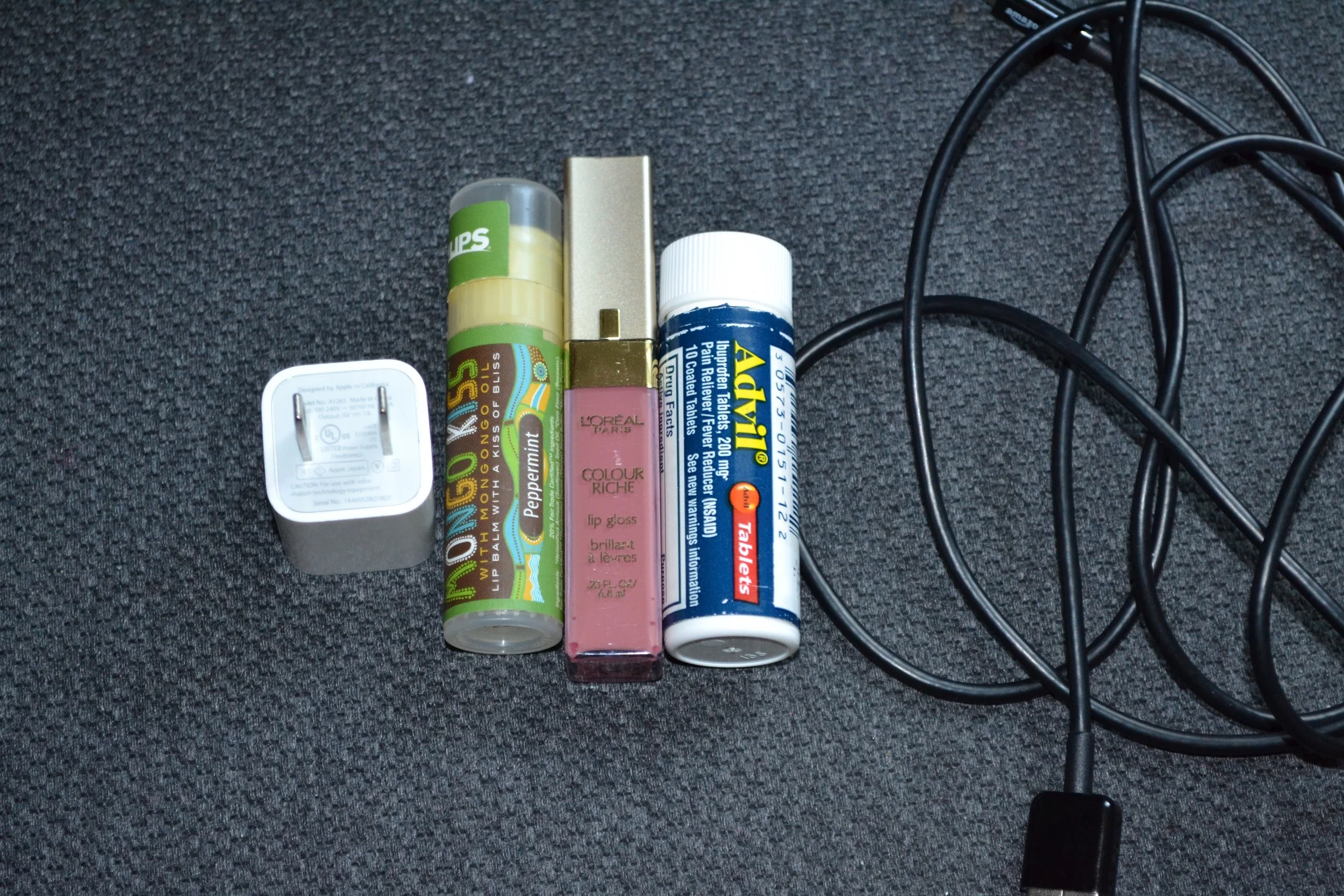 *Extra long iPhone cable and plug * Mongo Kiss Lip Balm in Peppermint * L'Oreal Colour Riche Lip Gloss in Rich Pink *Advil (natch)