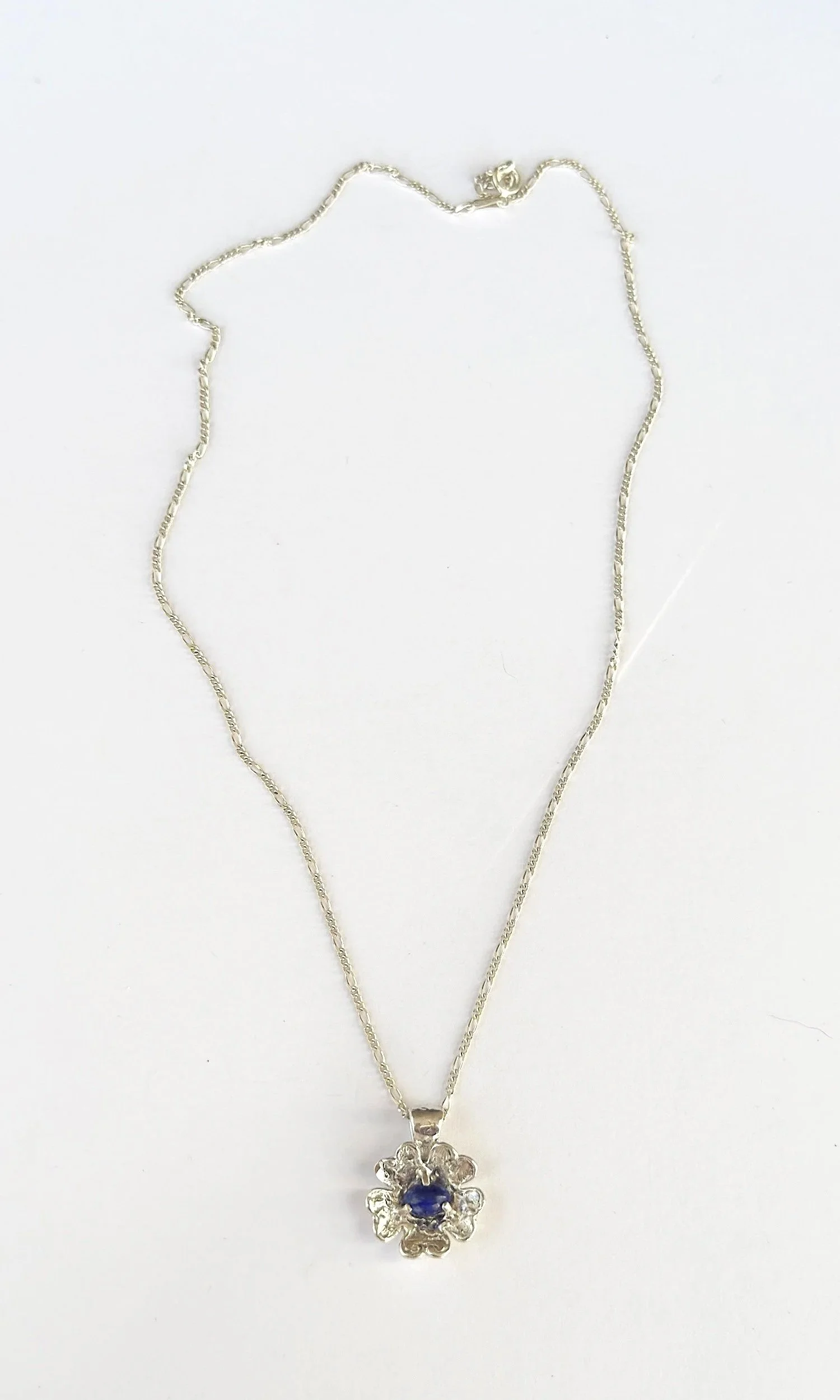 Silver dog rose pendant with deep blue lapis lazuli stone