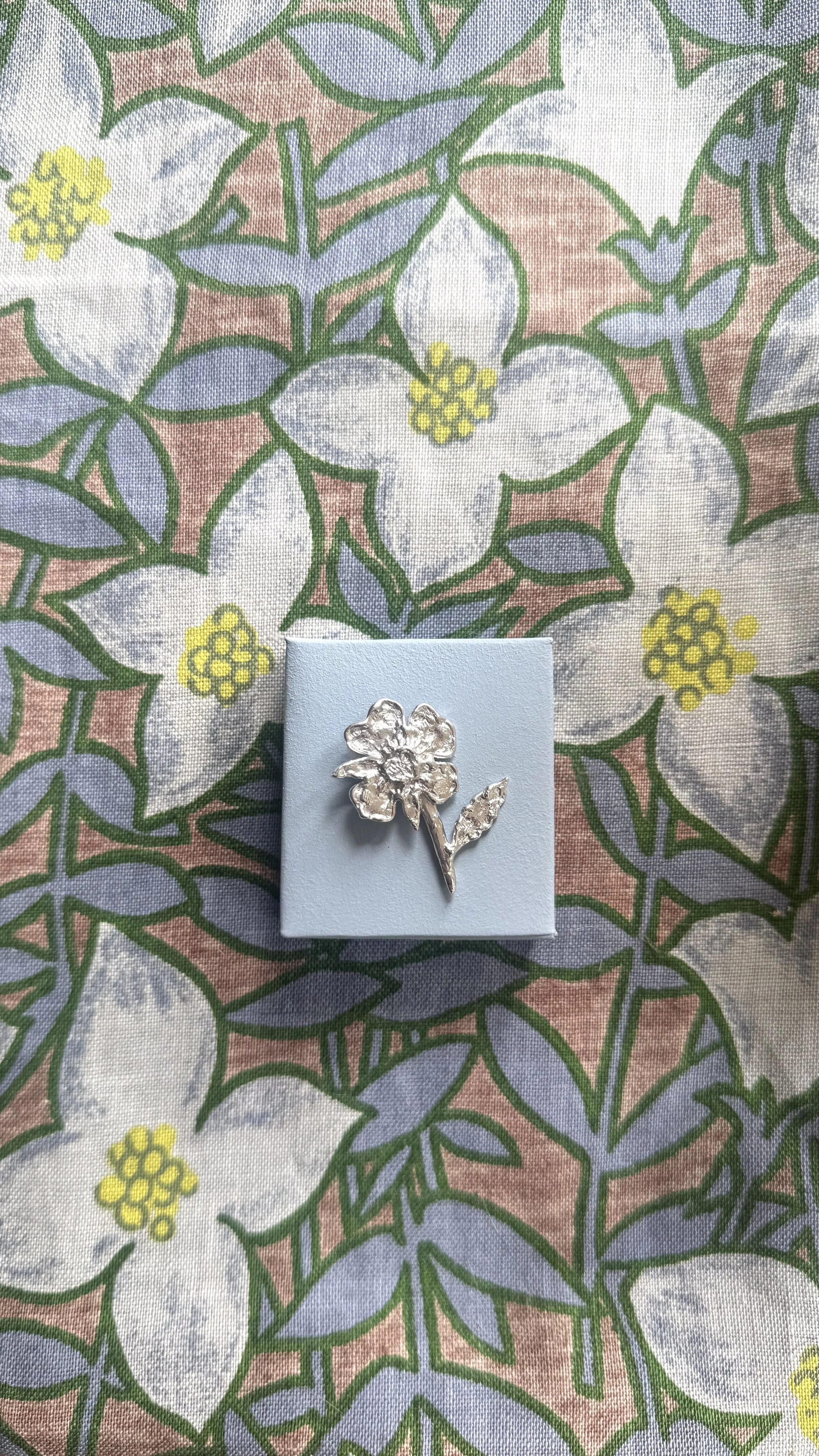 Silver flower with stem and leaf pendant cast in sterling silver