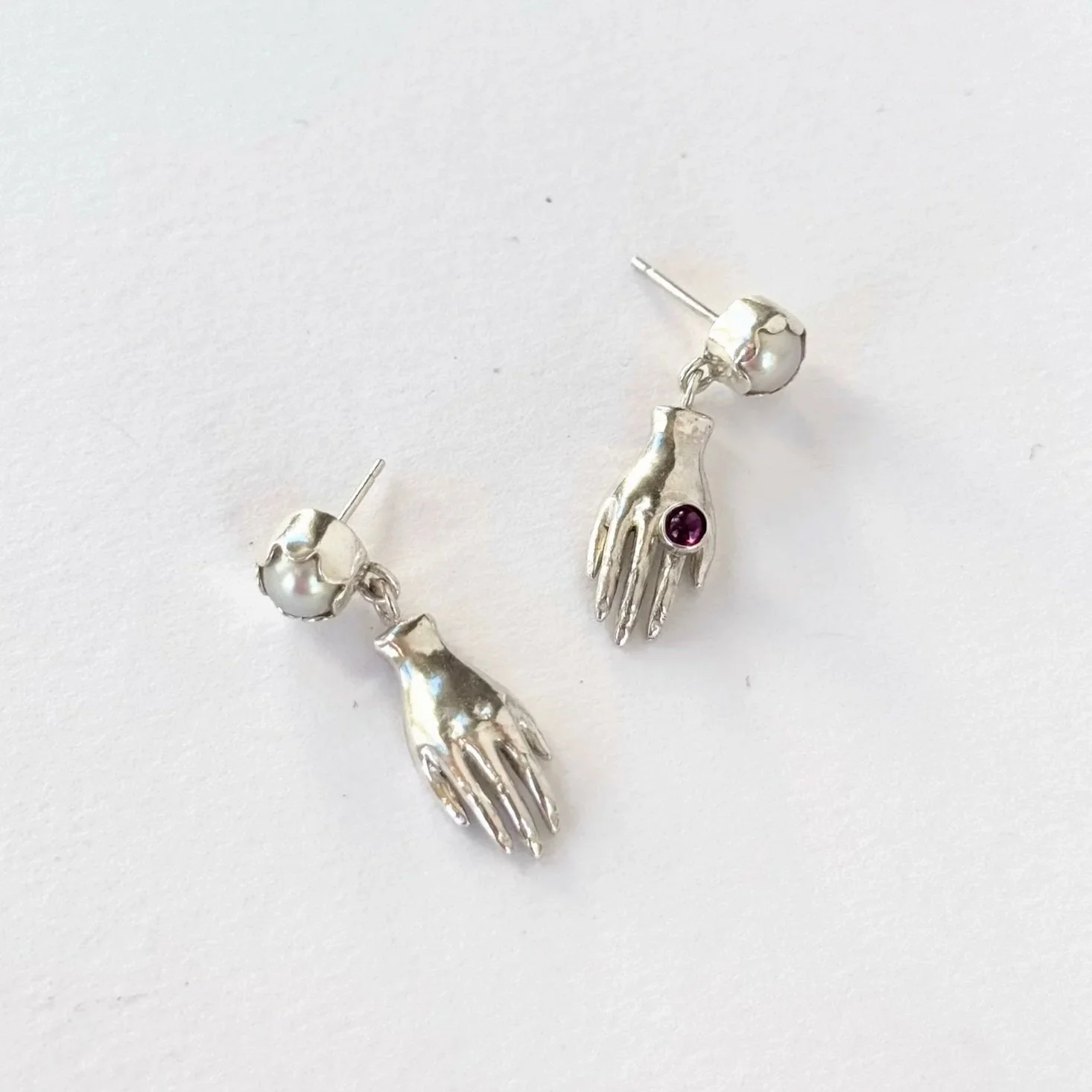 helping hand earrings with scalloped pearls