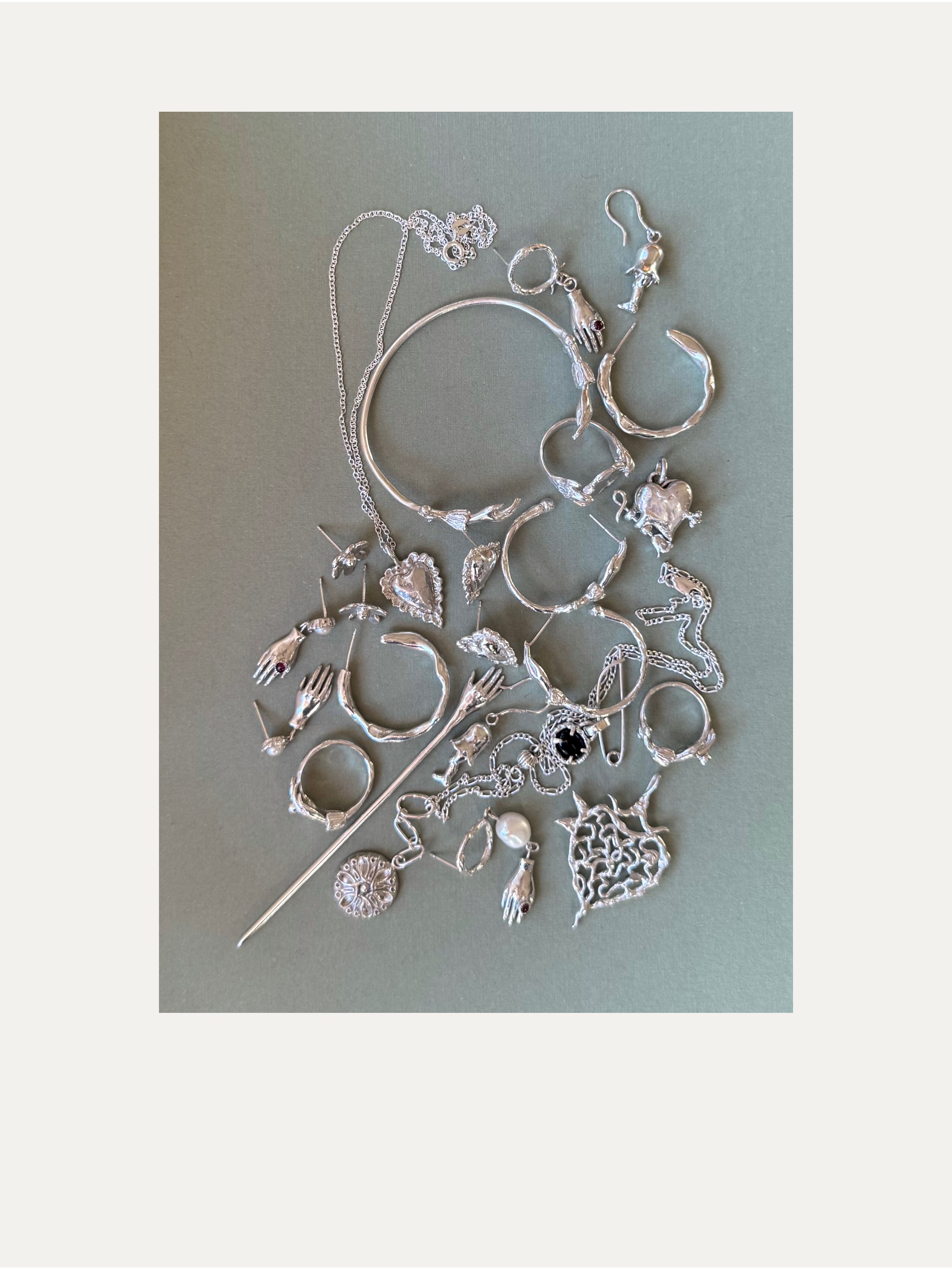 a pile of silver jewellry