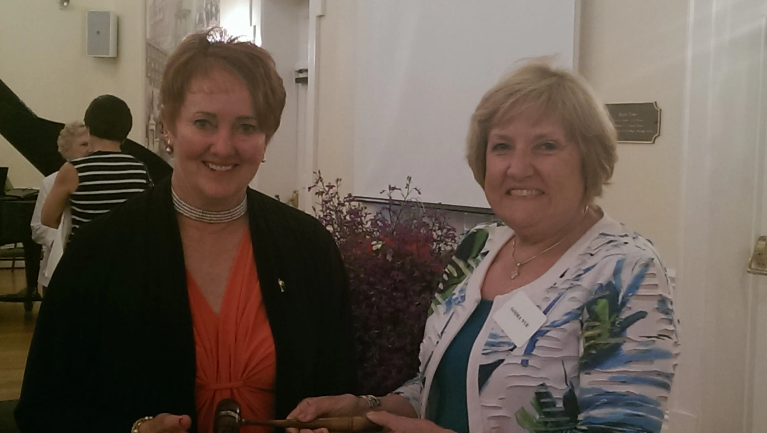 Past President Sandra Nye welcoming incoming President Karla Armstrong Hake. June 2, 2014