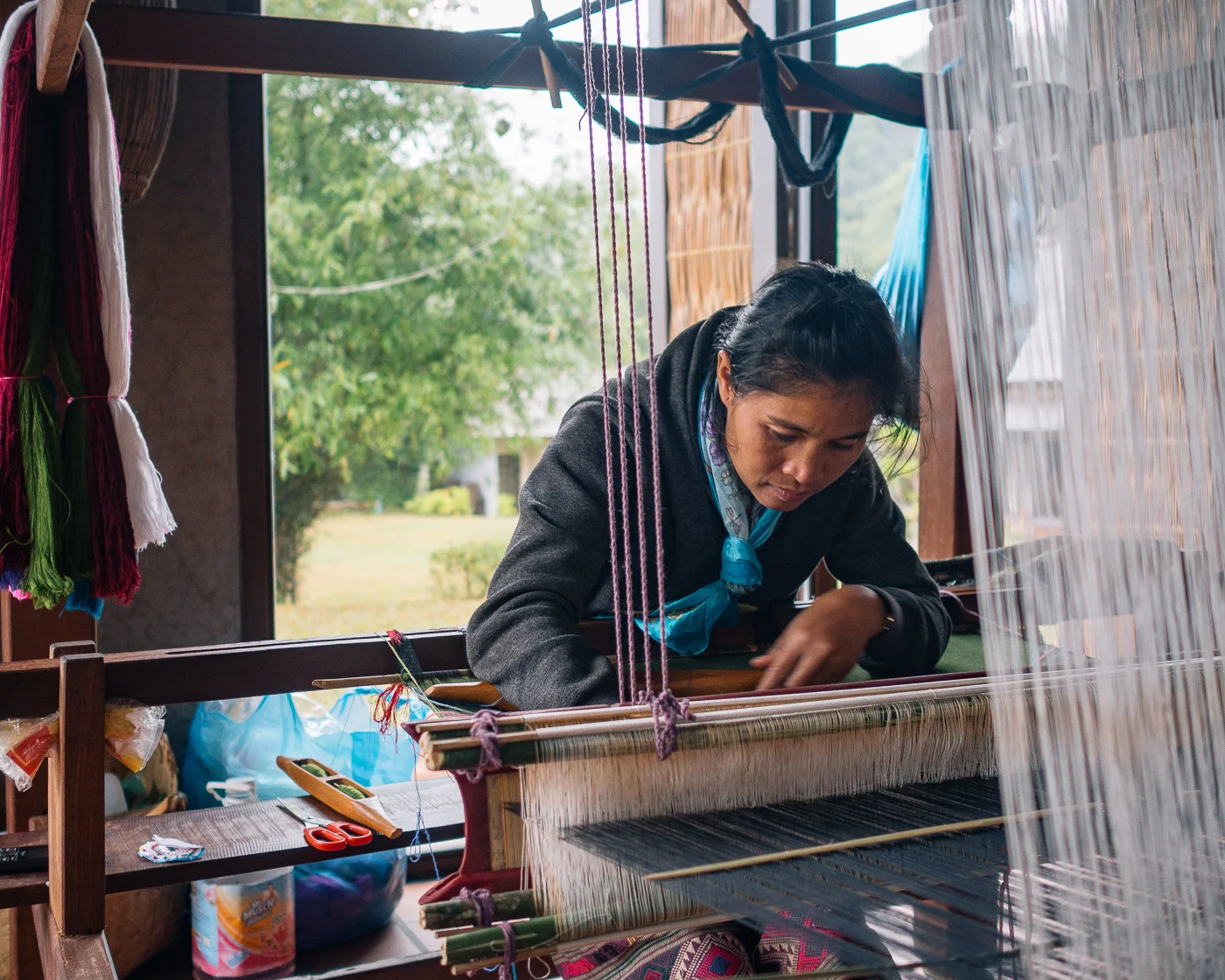 11. Khmu lady using a traditional loom. 