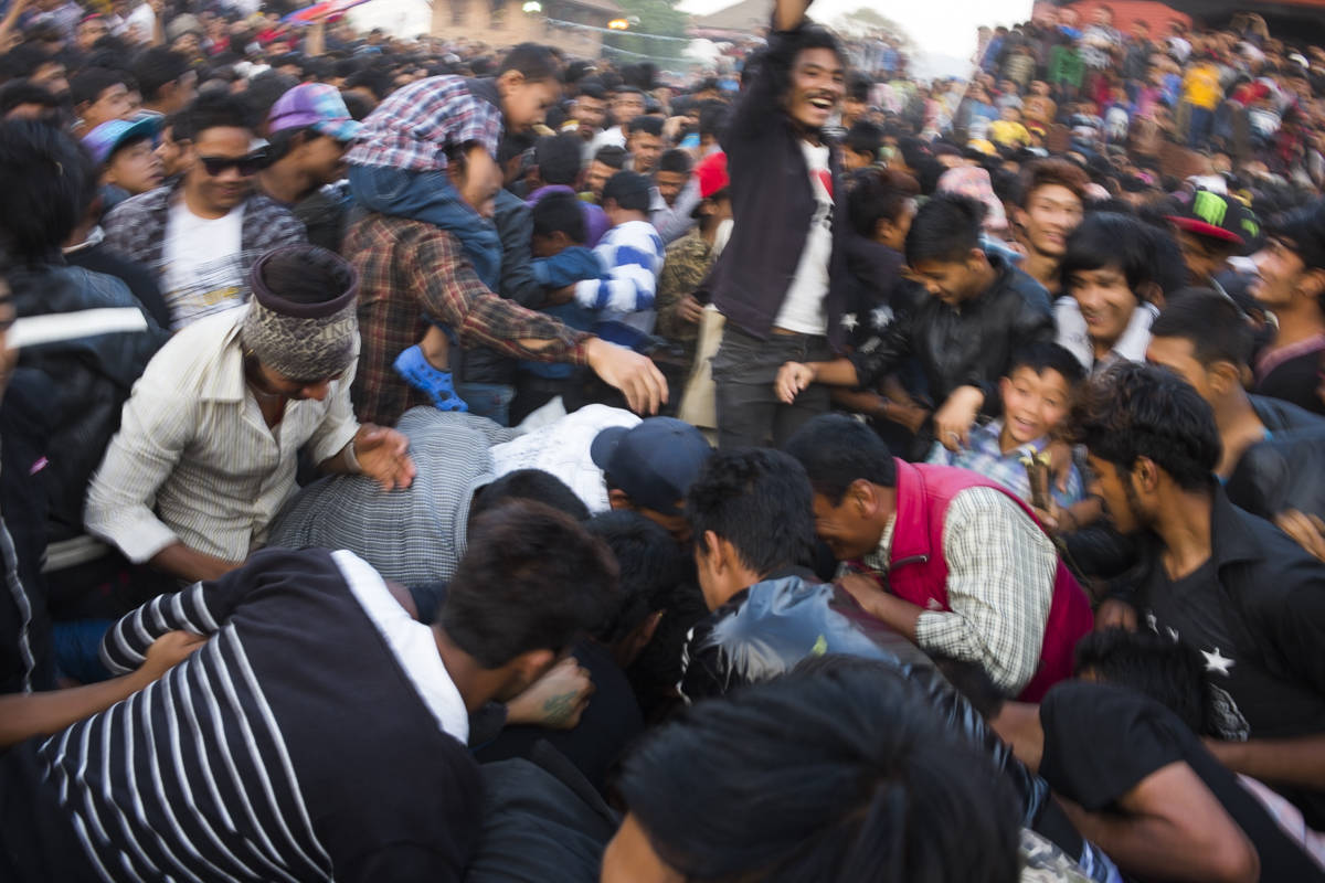 BHAKTAPUR In a violent act of tug-of-war, the west and east sides of town will force down the lingo, symbolizing the abolishment of the devil and appeasement of the wrathful God, Bhairava. The shrubs and leaves of the fallen lingo are hastily collected as a prize by the hundreds of participants.