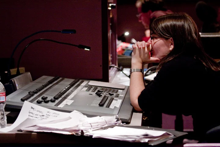 Rachel Dart in the booth on the road.