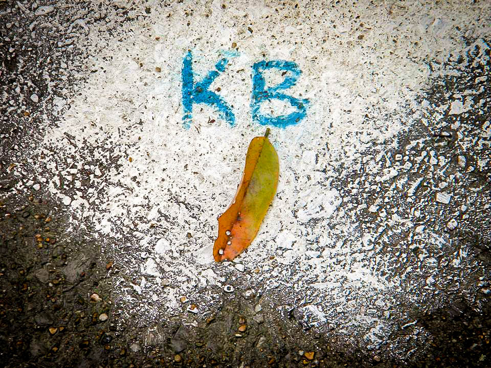 karla browns initials scribbled on pavement.jpg
