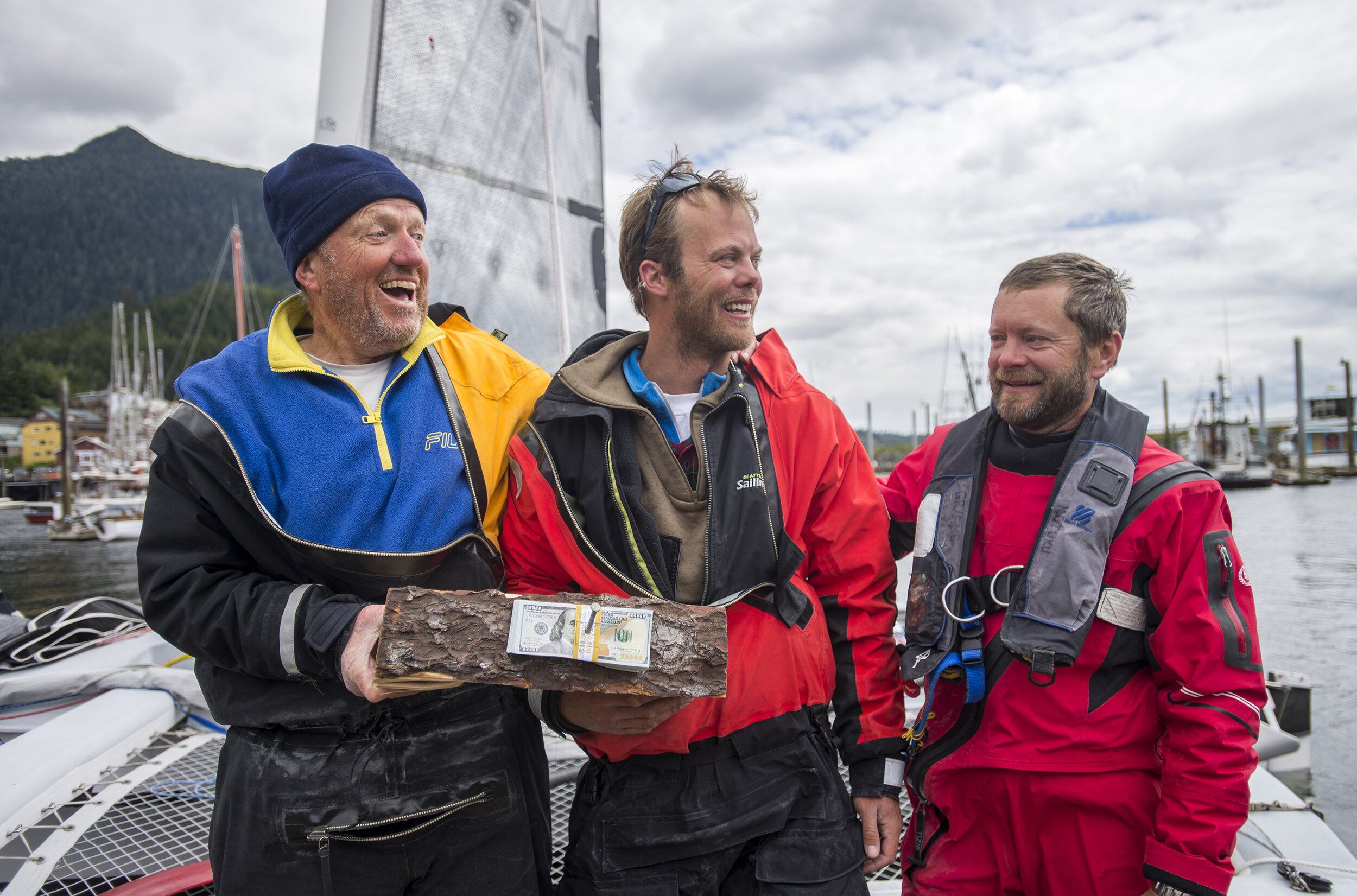  The three-person crew of Team Elsie Piddock (left to right: Captain Al Hughes, Matt Steverson, Graeme Esarey) holds their $10,000 cash prize up on Friday, June 12, 2015. © Ketchikan Daily News 