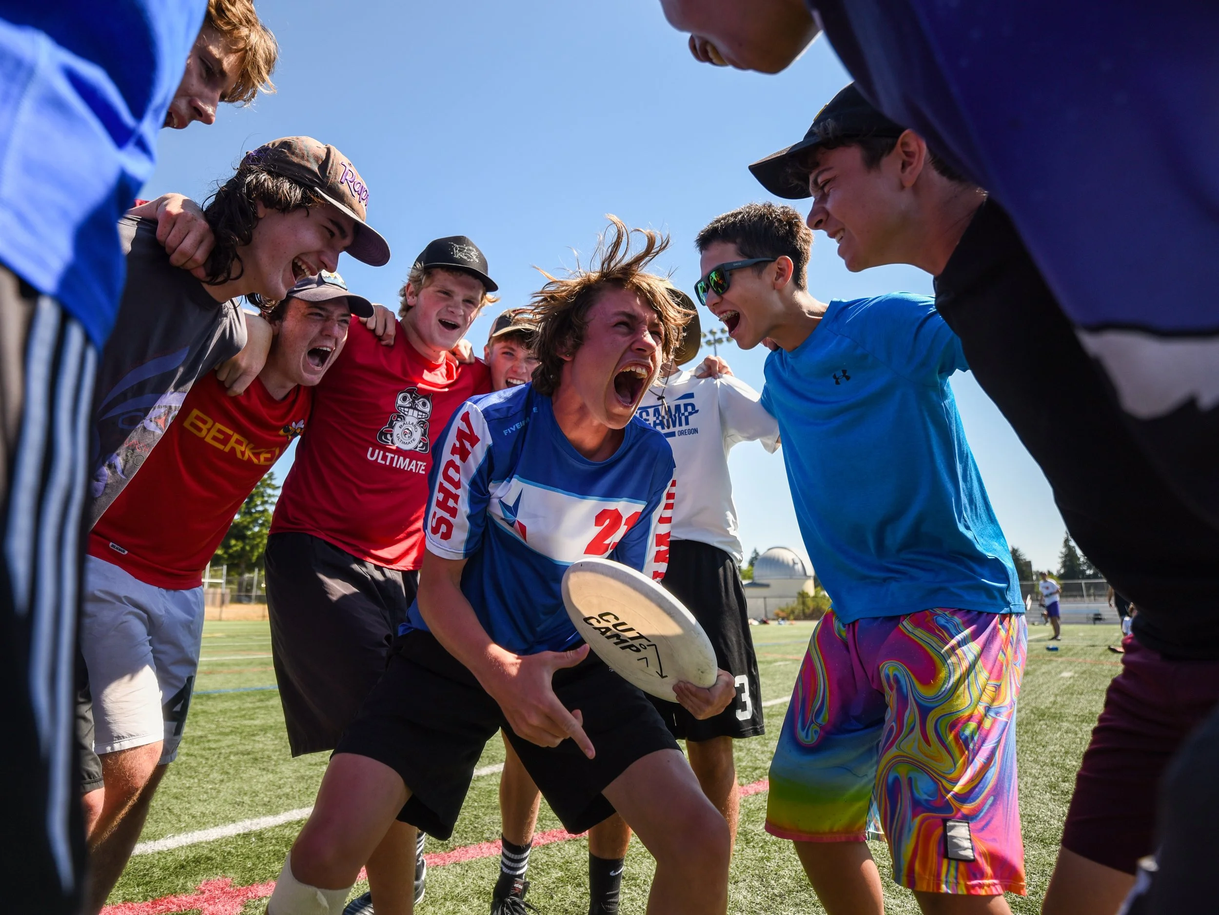  Players get hyped in a pregame huddle July 23, 2021, during the final day of Competitive Ultimate Training Camp at Pacific Lutheran University in Tacoma, Wash. 
