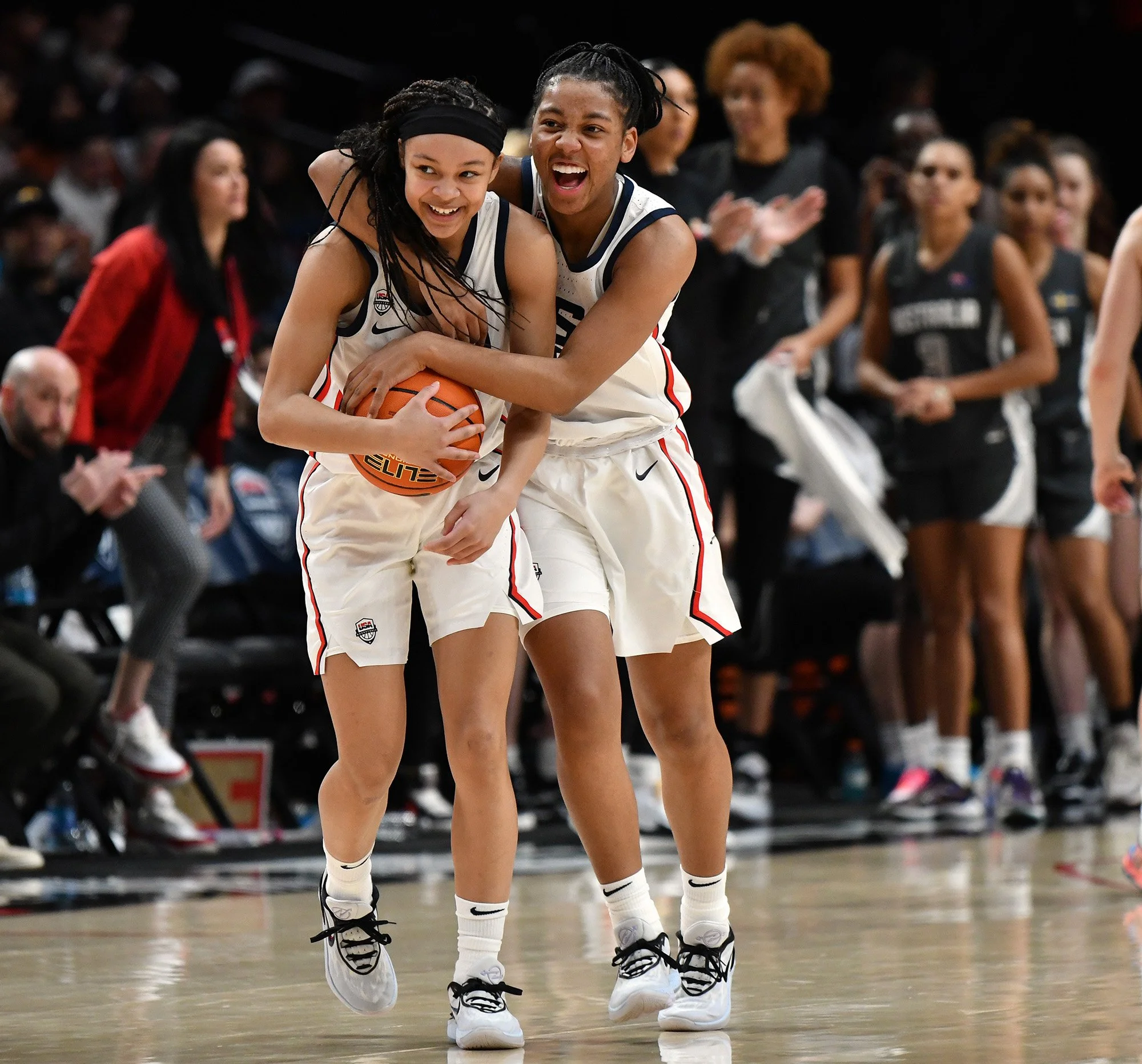   2023 NPPA Monthly News Clip Contest 1st Place   Team USA’s Kamorea "KK" Arnold, right, hugs teammate Hannah Hidalgo on April 8, 2023, after their 100-79 win against Team World Select in the 2023 Nike Hoop Summit at Moda Center in Portland, Ore. 
