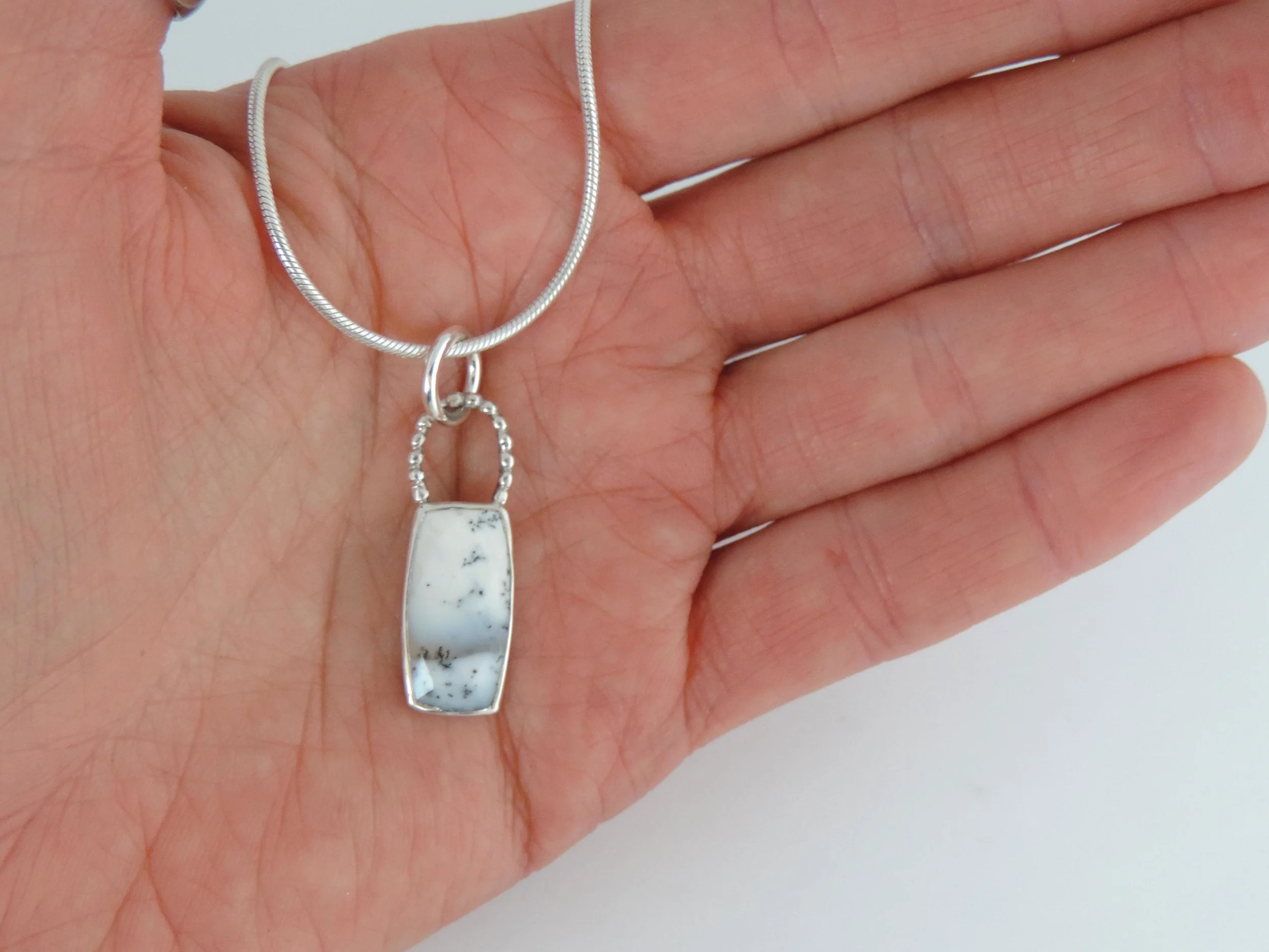 Faceted Snow globe agate pendant