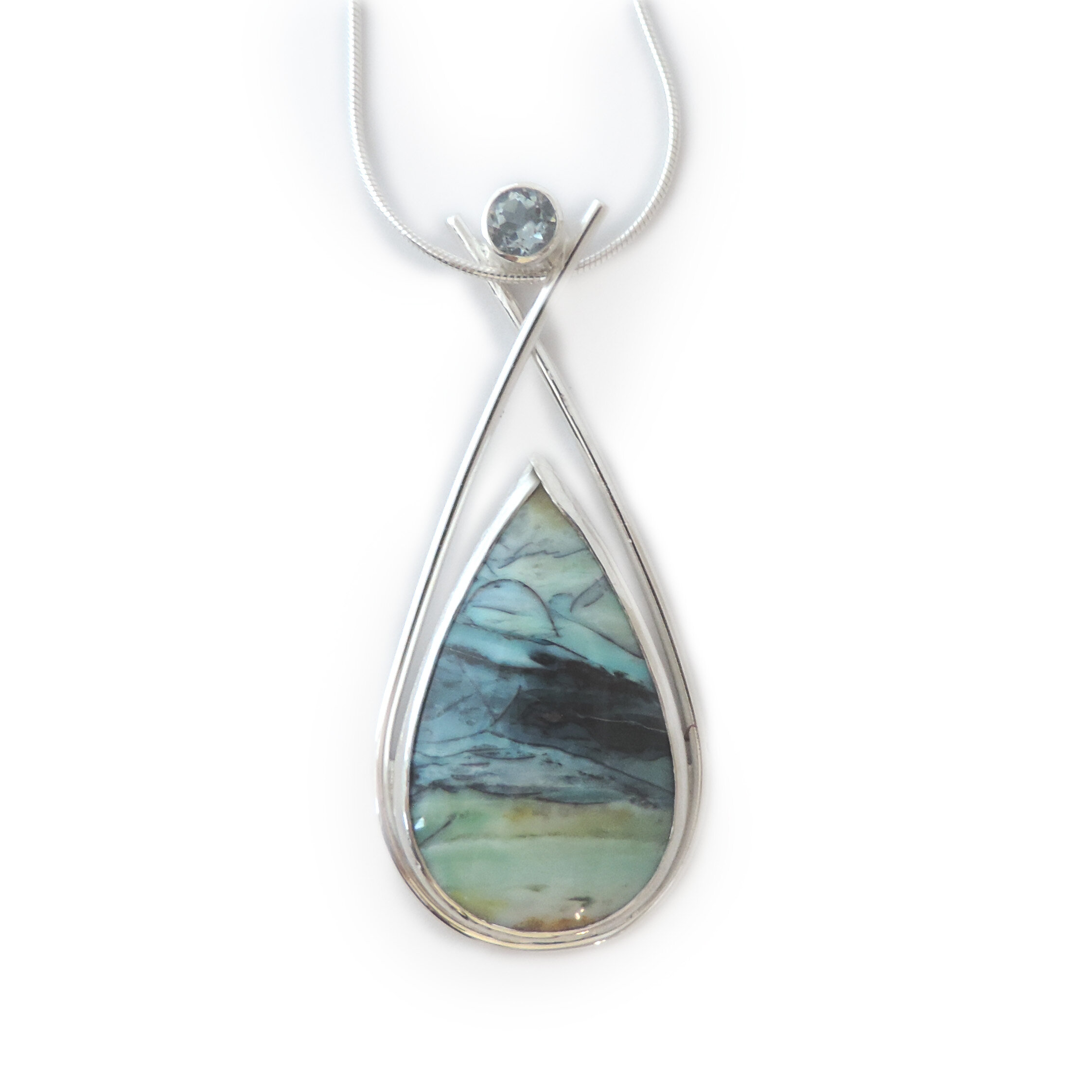 Large opalized wood pendant with sky blue topaz