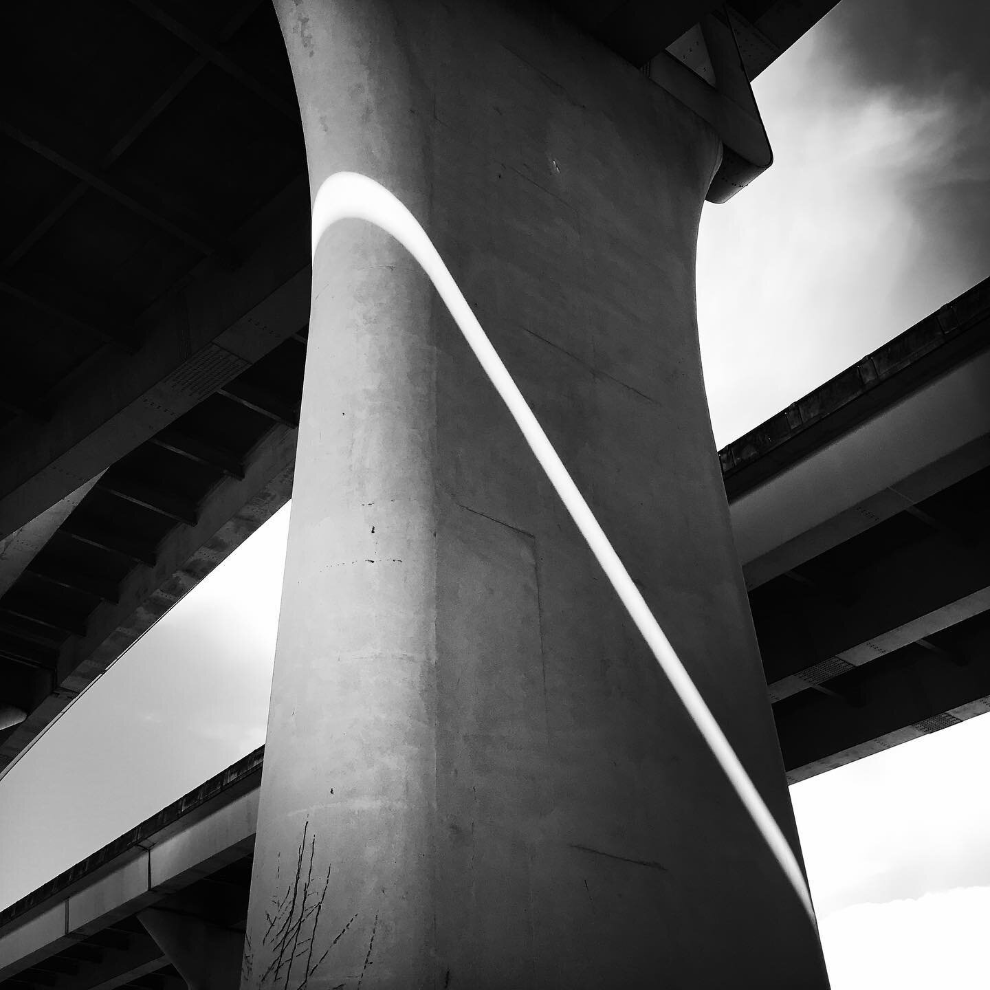 Sliver. #sunlight #portland #bridge #support #bw #bwphotography #hipstamatic #blackandwhite #instablackandwhite #blackandwhitephotography #photo #industrial #abstract #light #architecturephotography