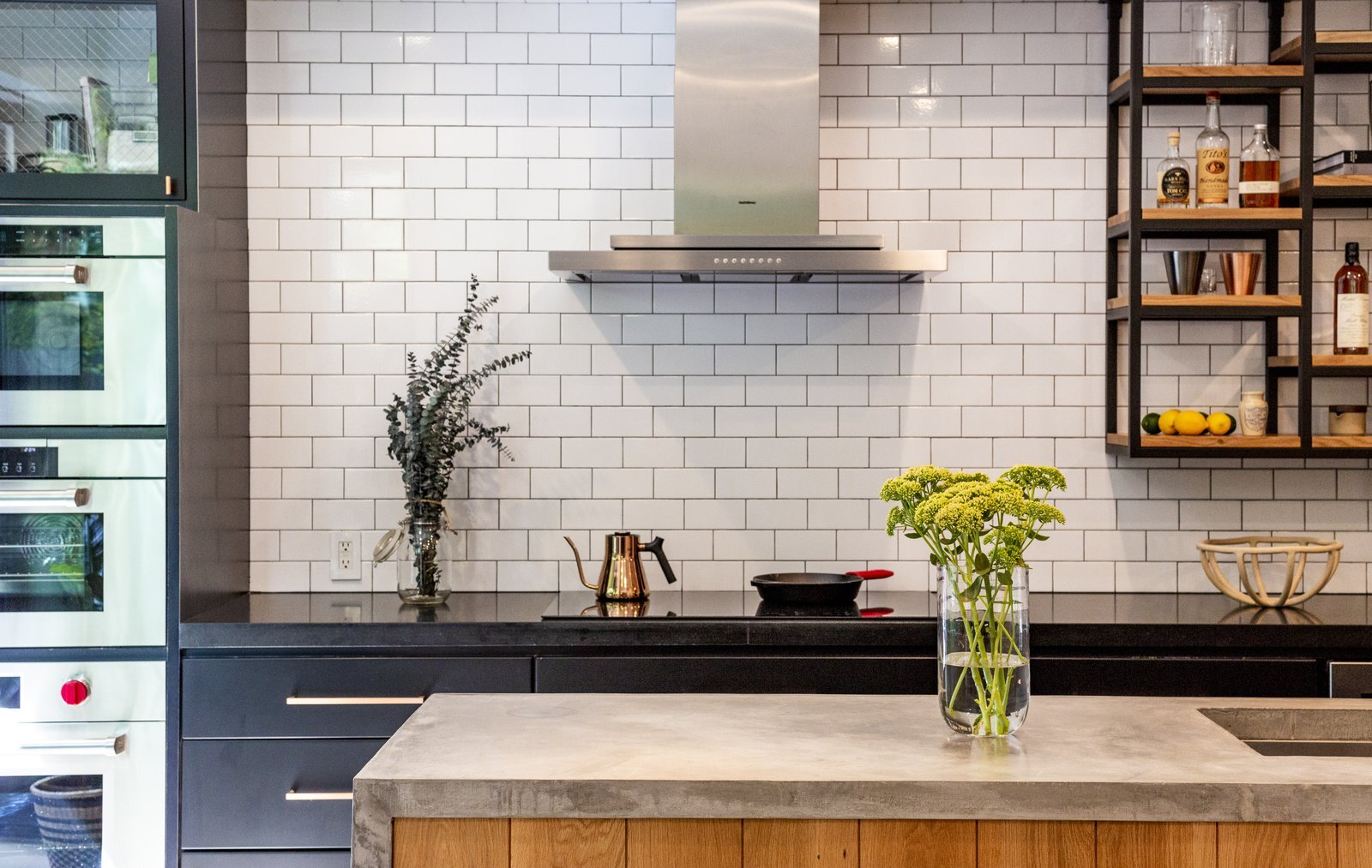 concrete-countertop-oak-panel-metal-laminated-drawers-and-subway-tiles-for-the-kitchen-custom-made-shelves.jpeg