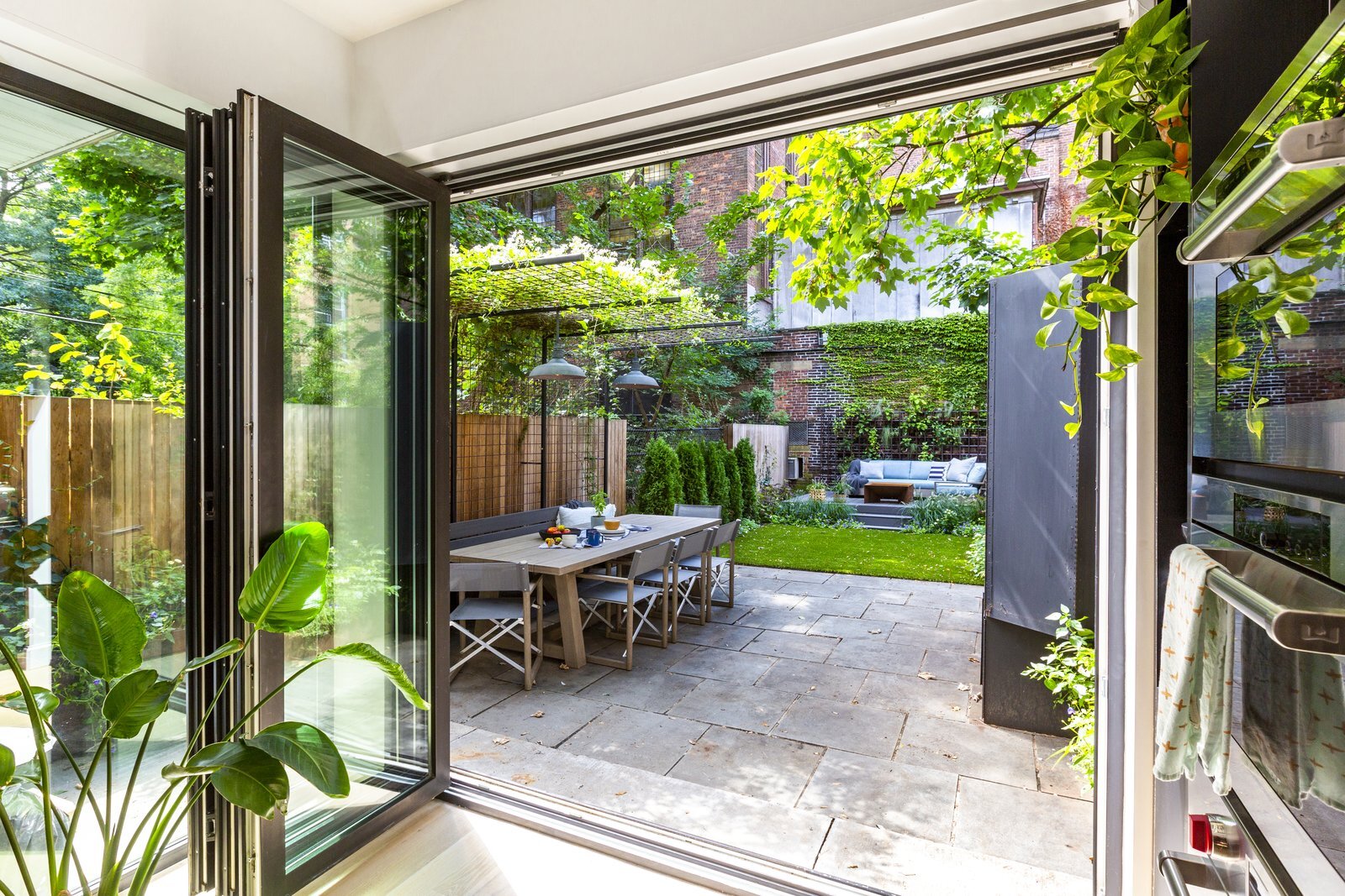 this-direct-access-to-the-outdoor-space-makes-the-whole-garden-level-a-great-space-to-cook-entertain-and-hang-out.jpeg