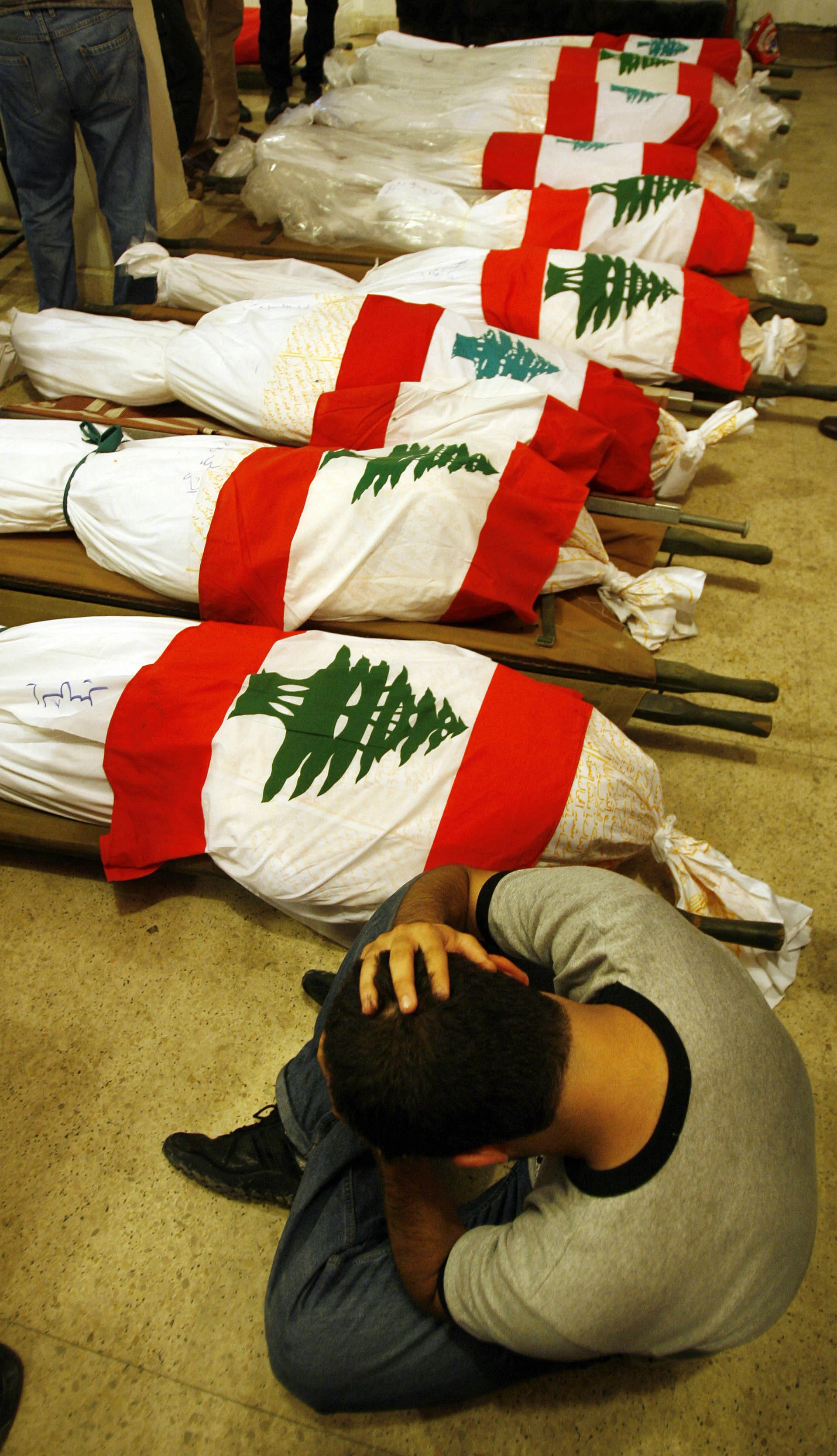 A young man mourns victims of an Israeli attack on an apartment block in the Hezbollah stronghold of Dahia, Beirut, 2006.