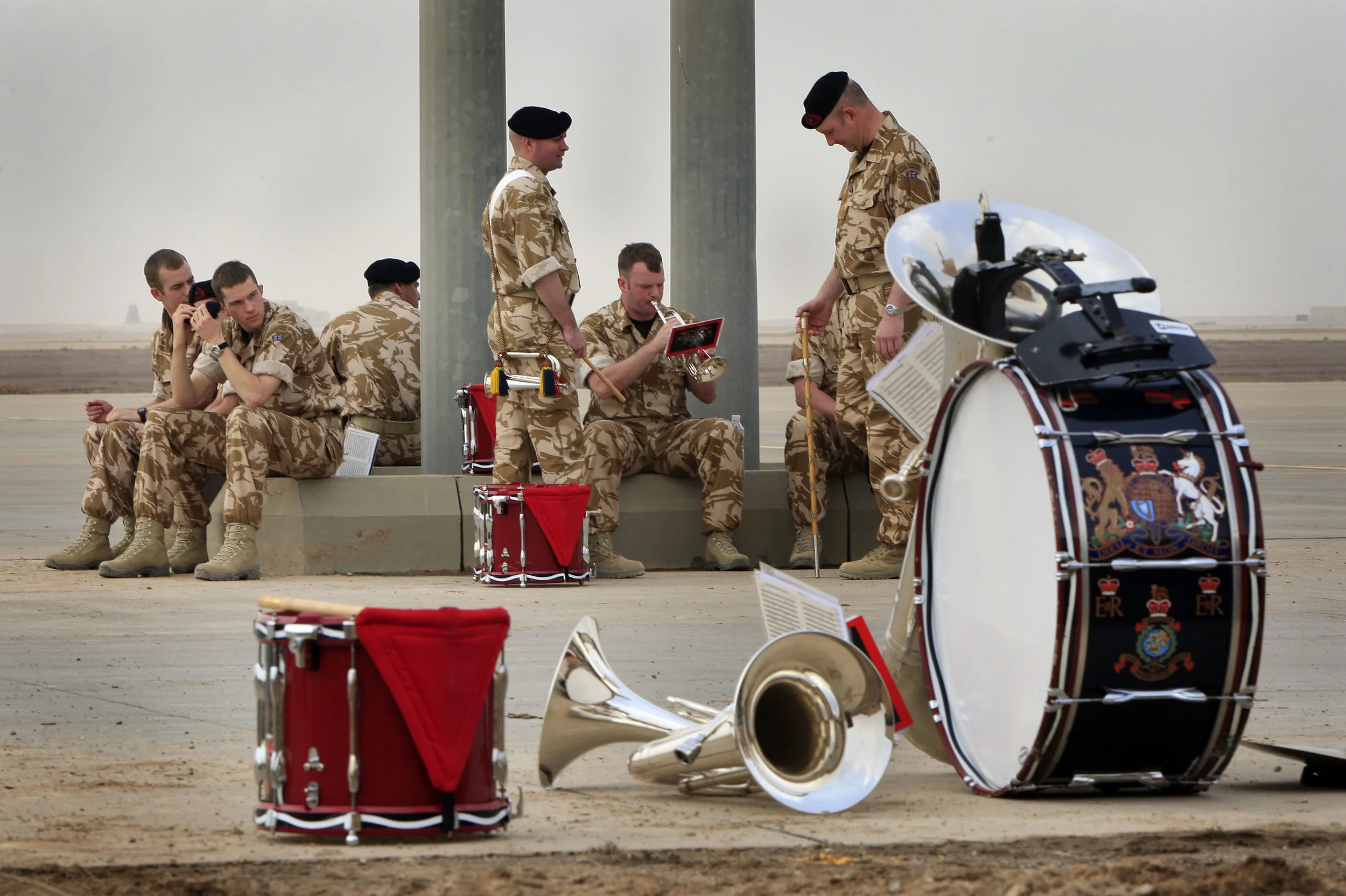  A British military band wait to play at the 'Transfer of Authority' ceremony at Basra airport, the main coalition base in southern Iraq. British responsibility for the region was handed over to the U.S. military. April, 2009. 