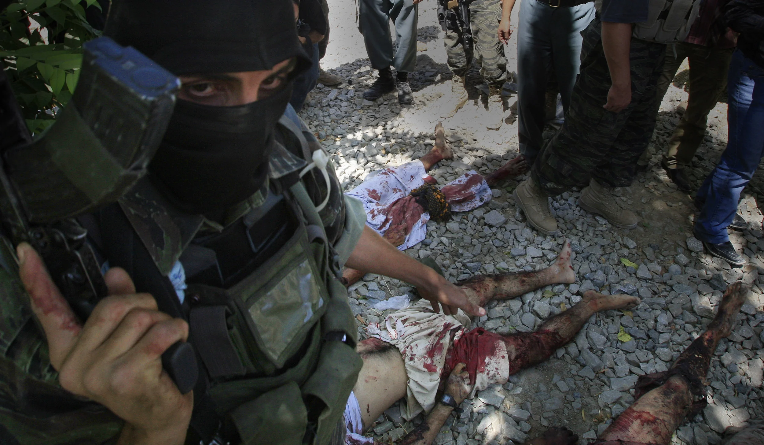  Afghan Special Forces show off a group insurgents that they killed during a shoot-out in Kabul, Afghanistan, 2009. 