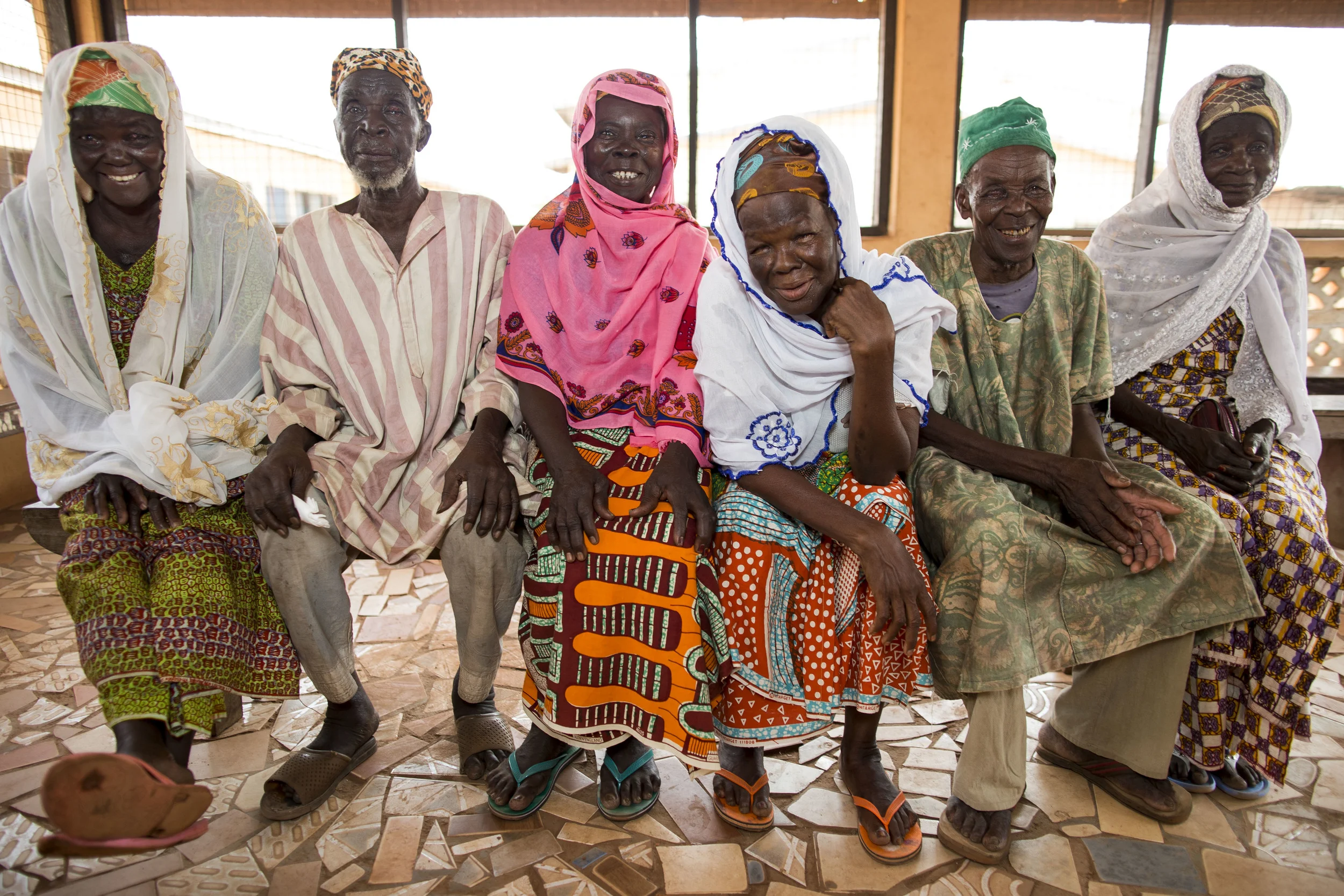 Six happy post-op trichiasis patients shortly after having their stitches removed at a clinic near to Tamale, Ghana. 'Sightsavers', with the Ghanaian health service is combating trachoma. November 2013.