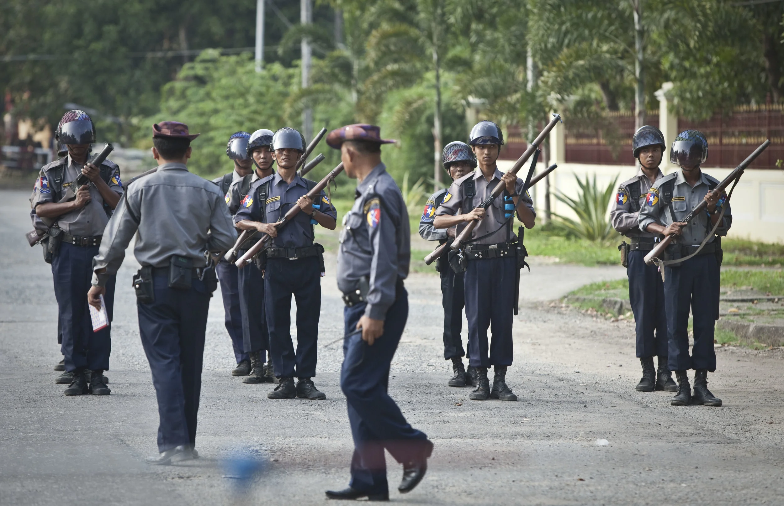  Burmese para-military police stand guard near to the home of Aung San Suu Kyi prior to her being released from 15 years of house arrest. Rangoon, 2010. 